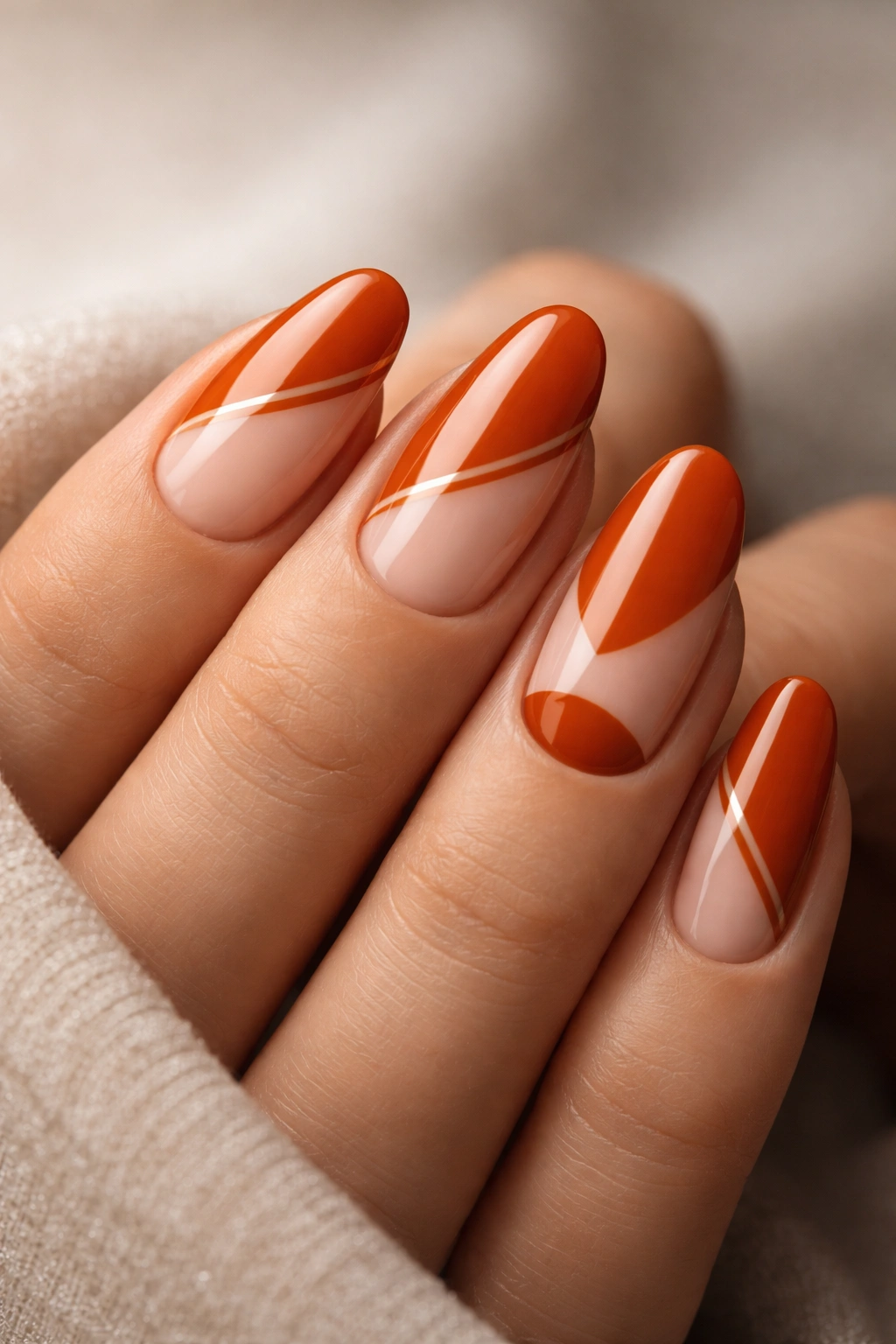 Burnt orange nails with negative-space geometric design