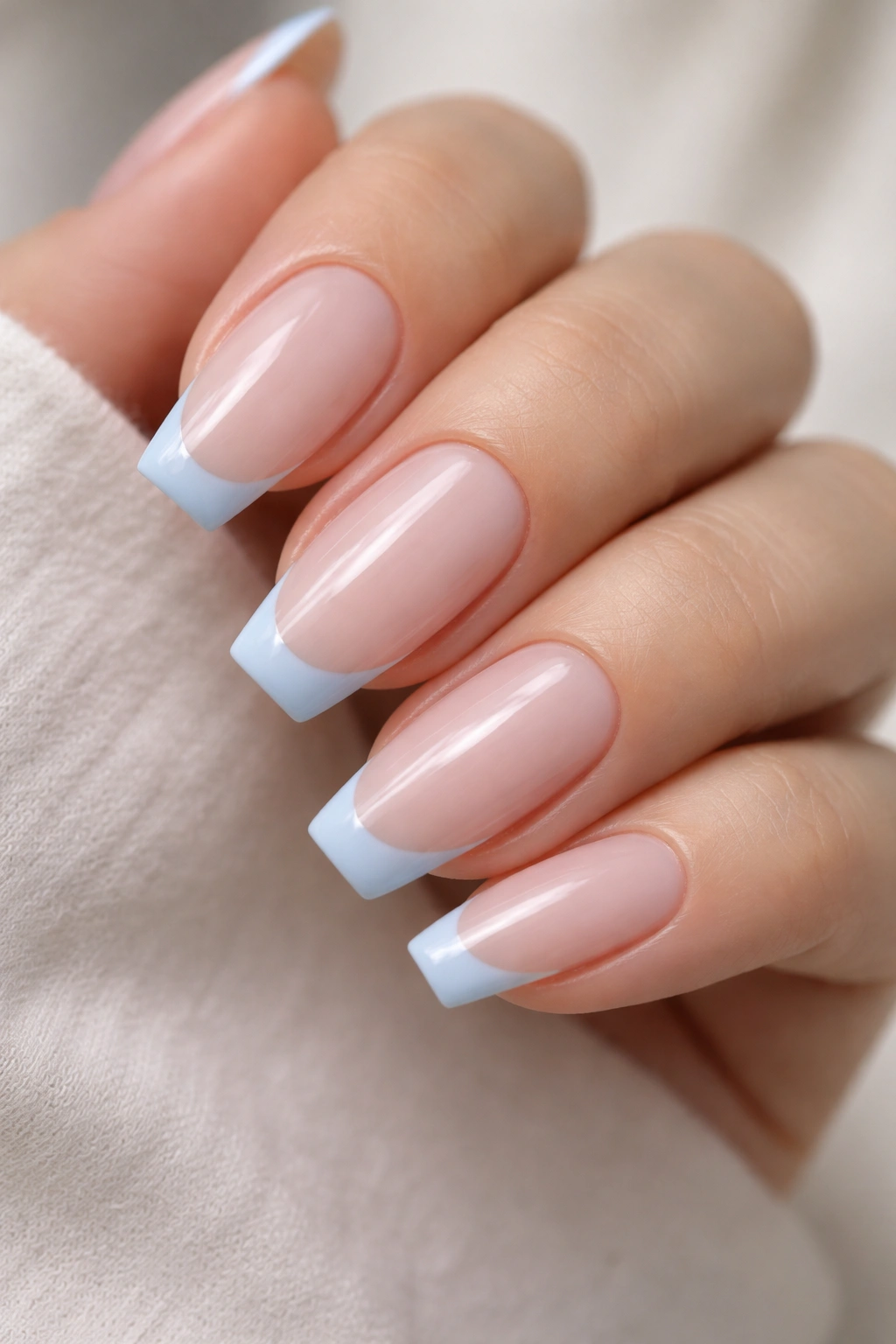 Blue micro-French on ballerina nails with slim blue tip