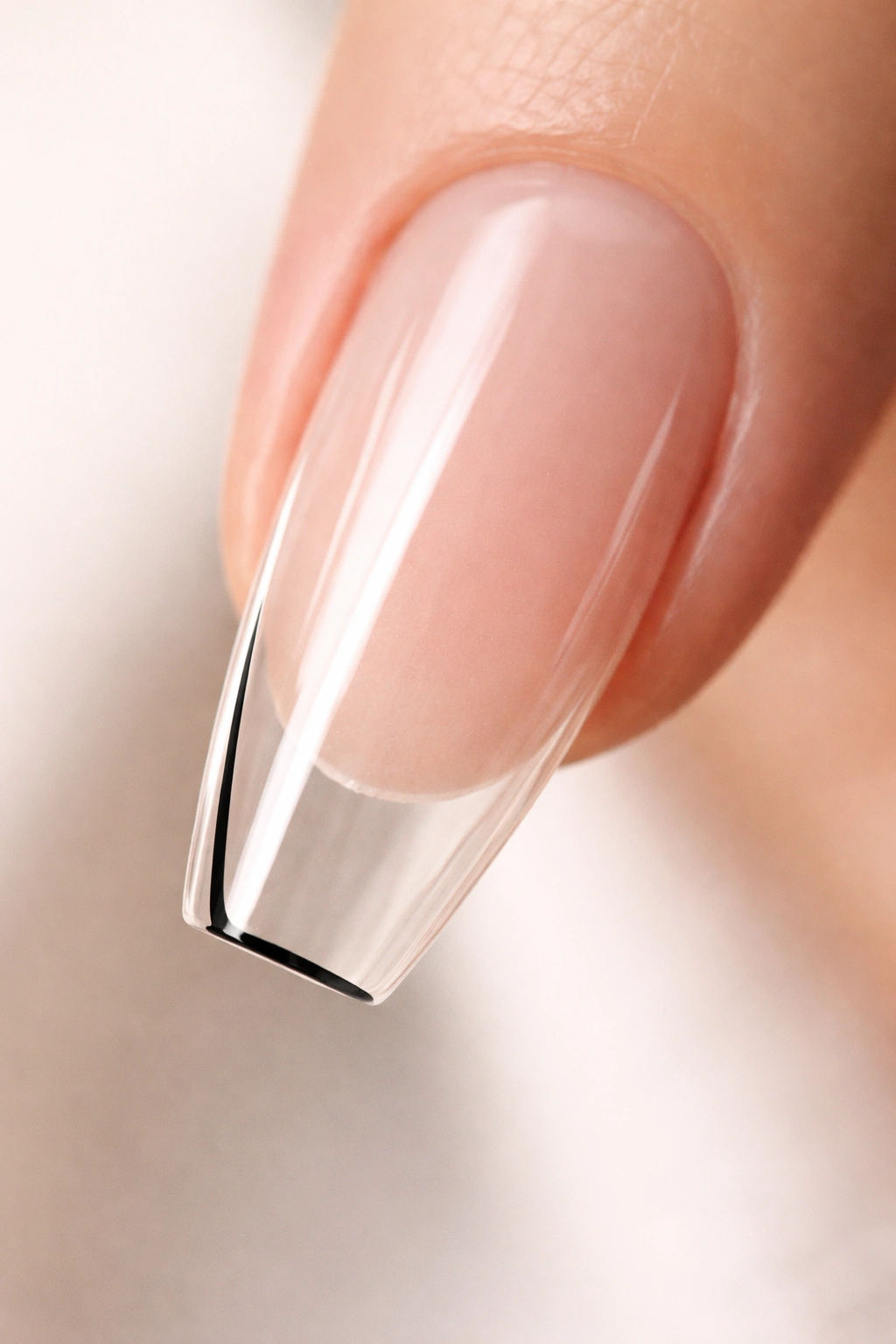 Clear ballerina nail with a single ultra-thin black line for sharp definition