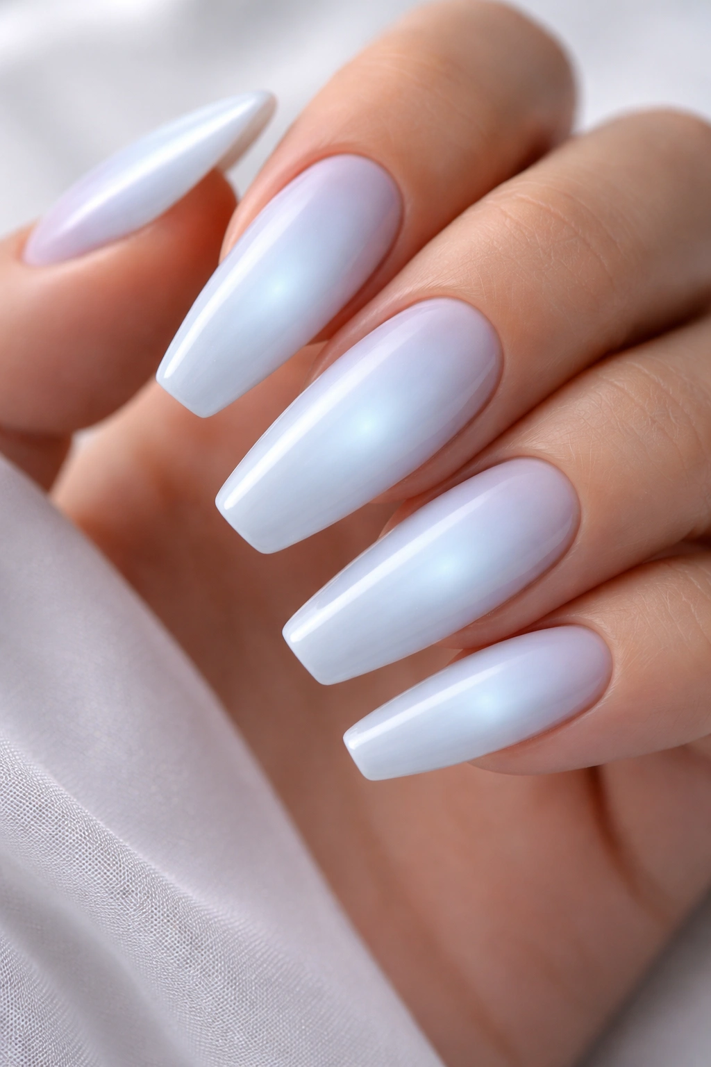 Nails with soft blue aura glow on ballerina shape