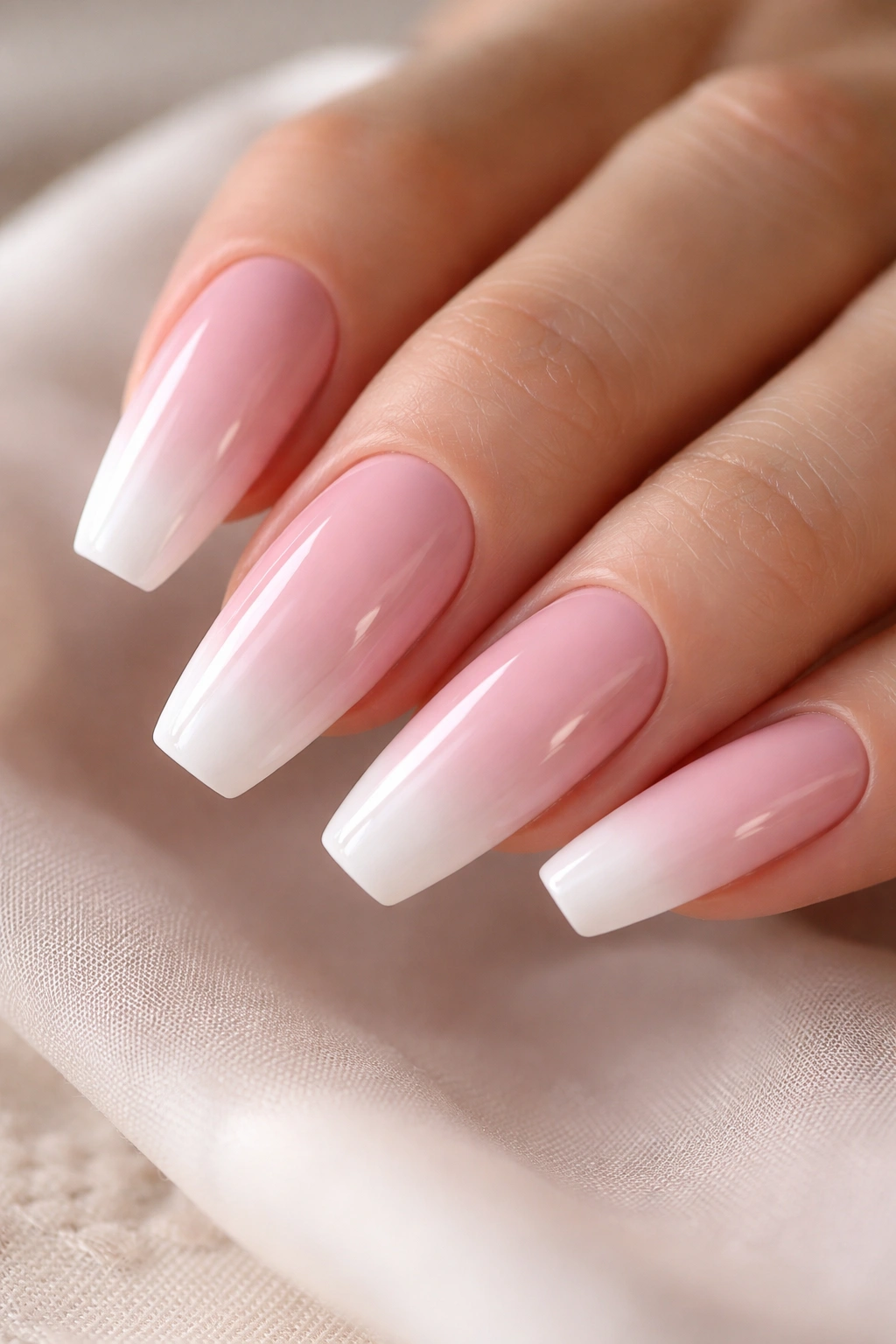 Blush pink base with white baby boomer tips on ballerina nails