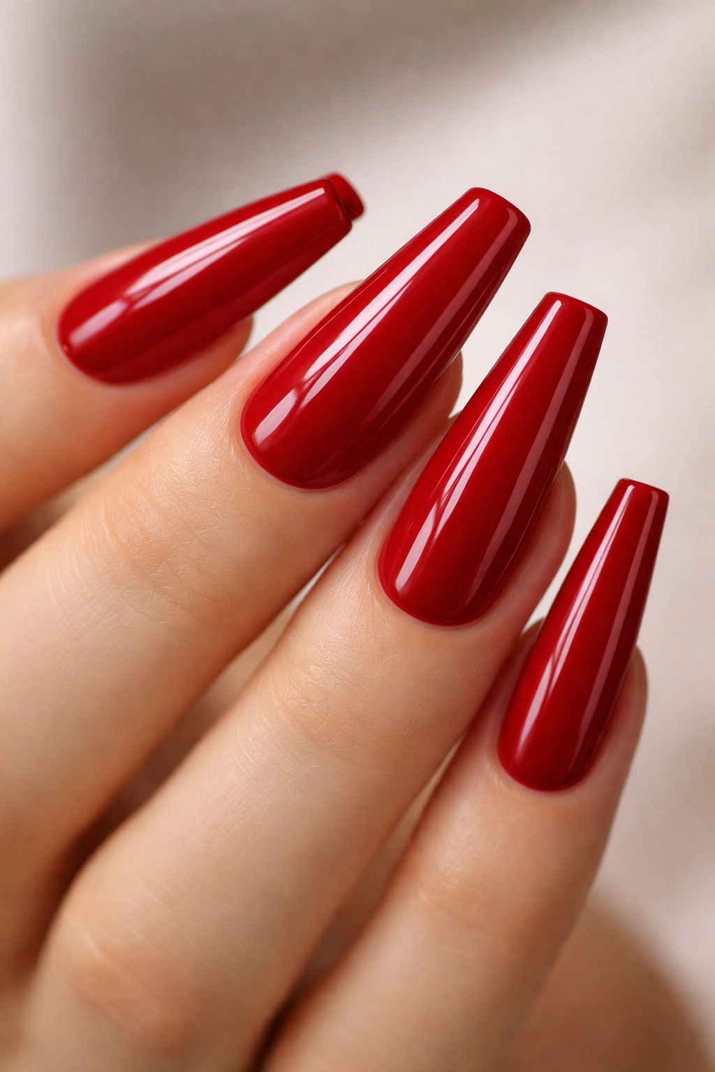 Glossy cherry red long ballerina nails with crisp sidewalls
