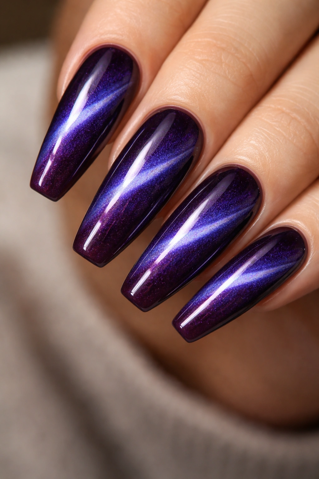 Deep iris cat-eye nails with diagonal magnetic line on ballerina shape