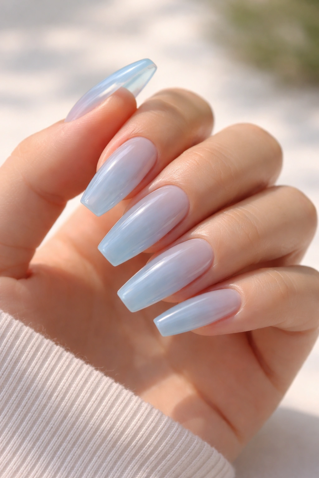 Translucent jelly nails in baby blue with glassy glow