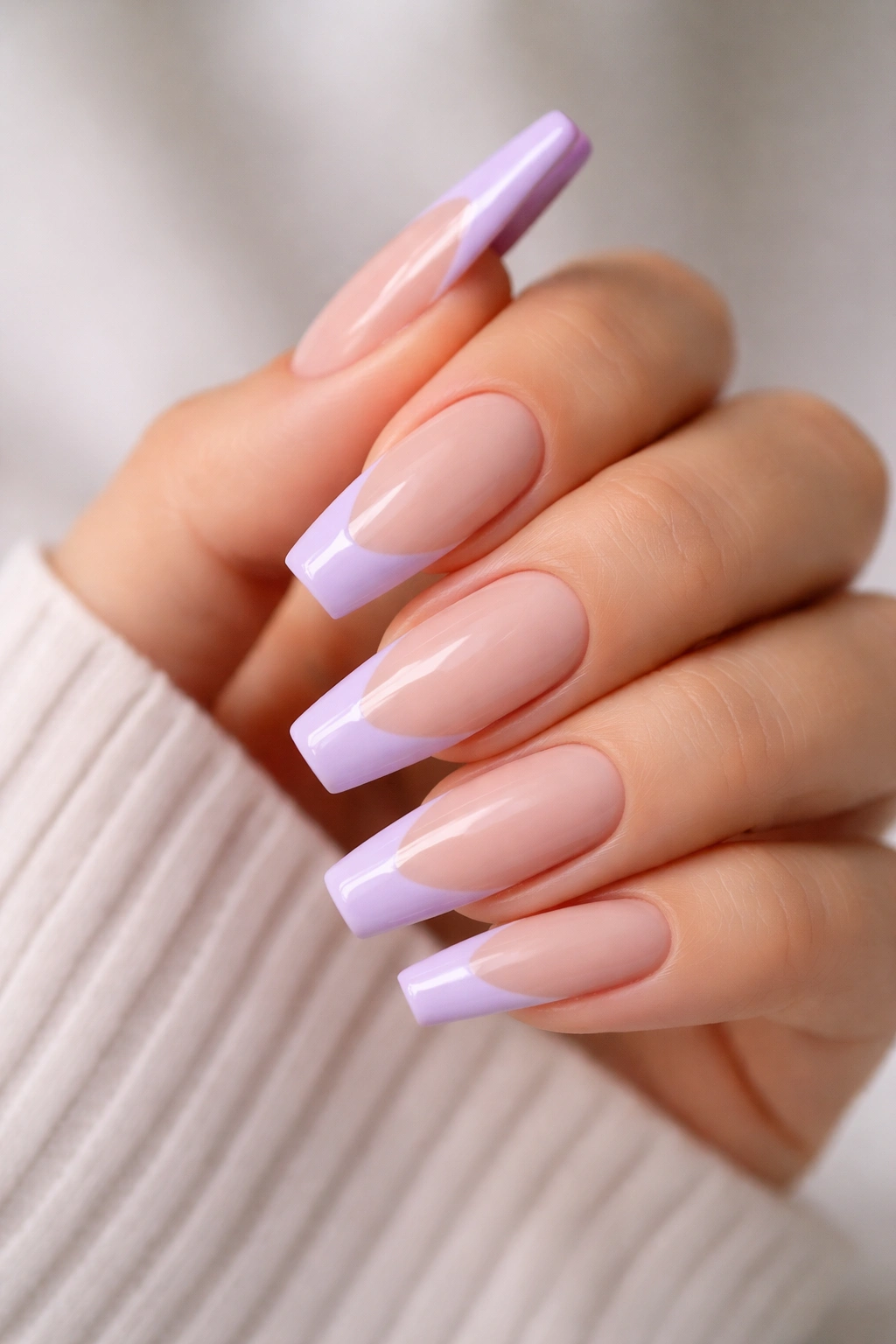 Lavender-tipped ballerina nails on nude base with crisp smile line.