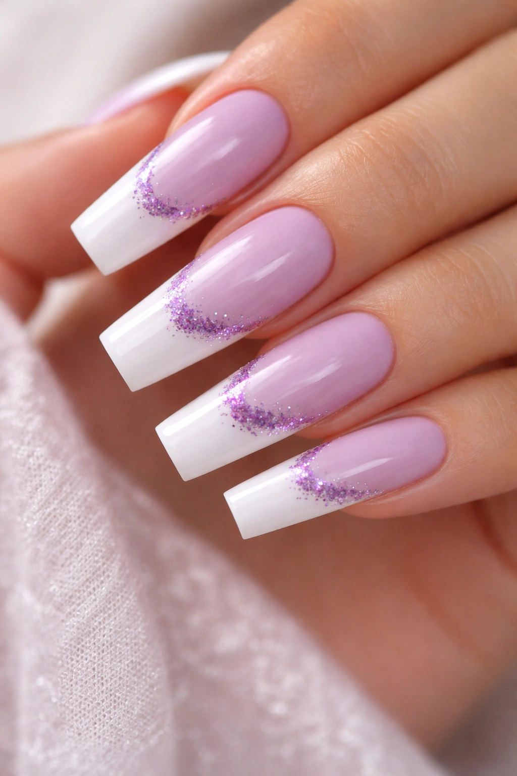 Lavender coffin nails with white tips and purple glitter accents