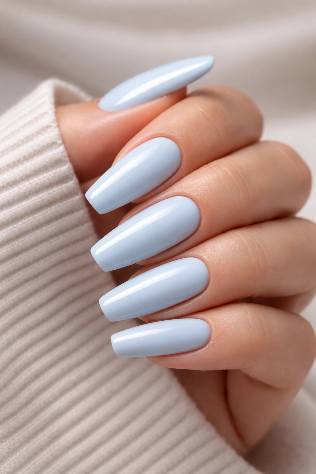 Milky blue nails with glossy finish avoiding chalky look