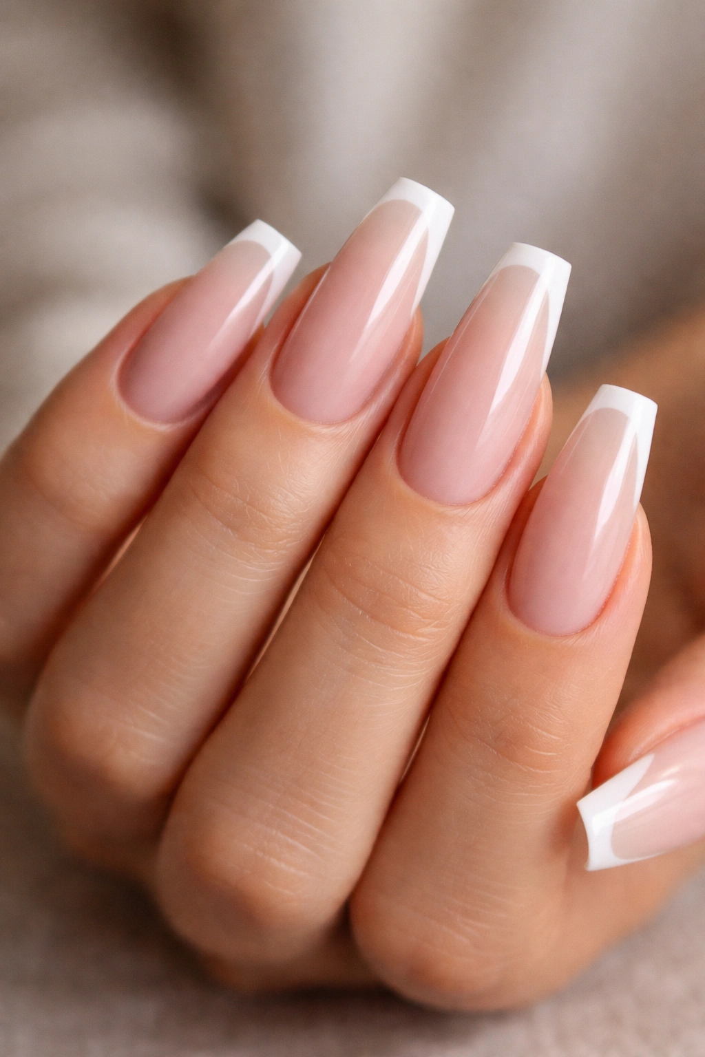 Long ballerina nails with milky nude base and micro French tips