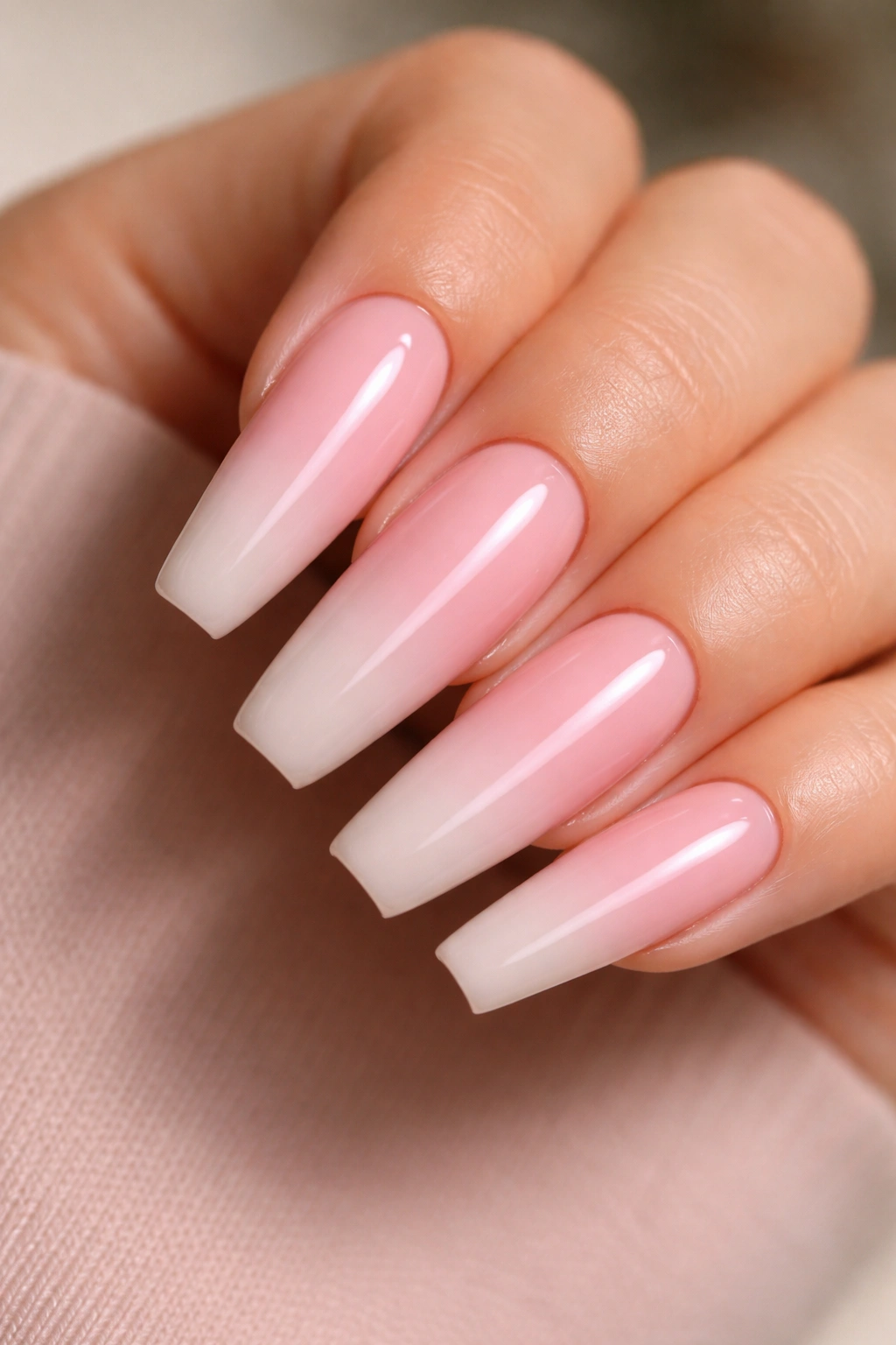Milky pink fading into nude on ballerina nails with glossy finish