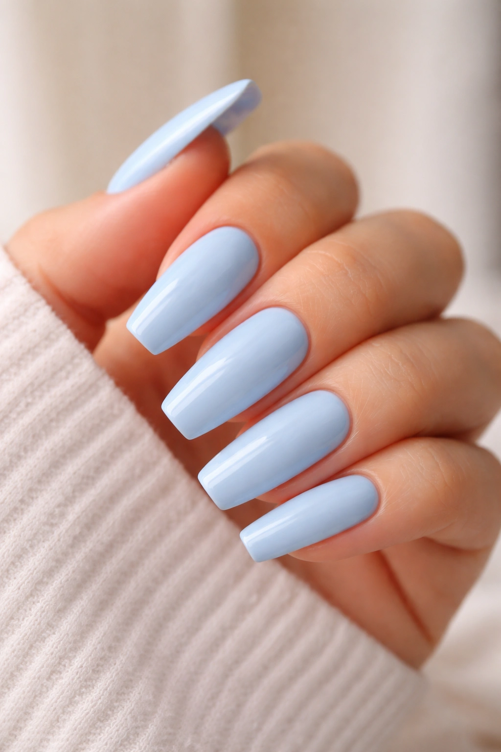 Medium-length blue ballerina nails showing tapered tips and sidewalls