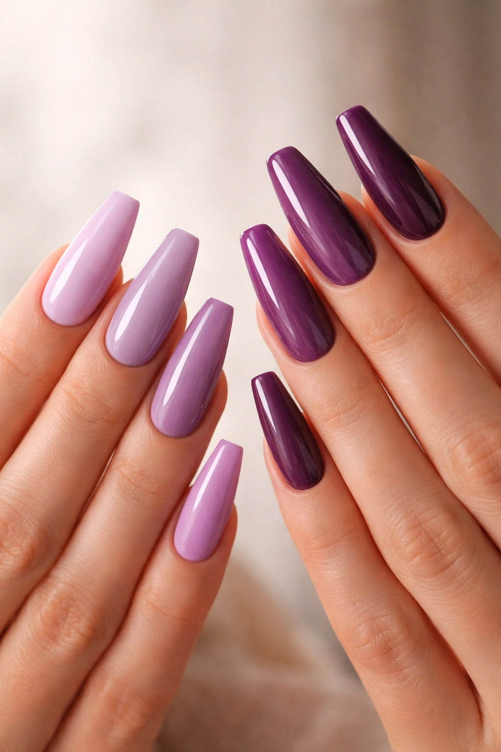 Close-up of purple gradient ballerina nails, lilac to plum, highlighting shape and color.