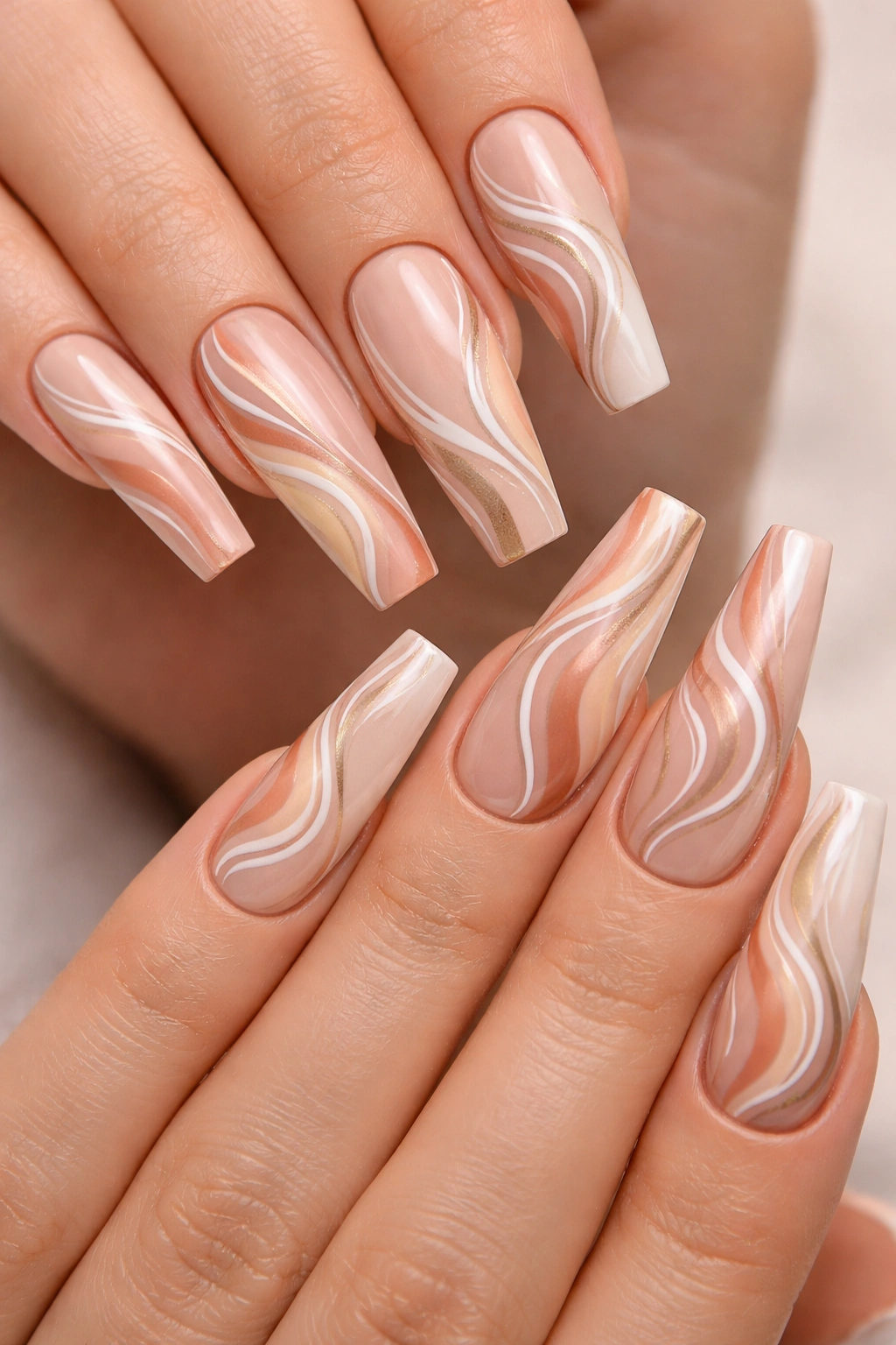 Close-up of coffin nails with abstract swirls and shapes in coordinated colors