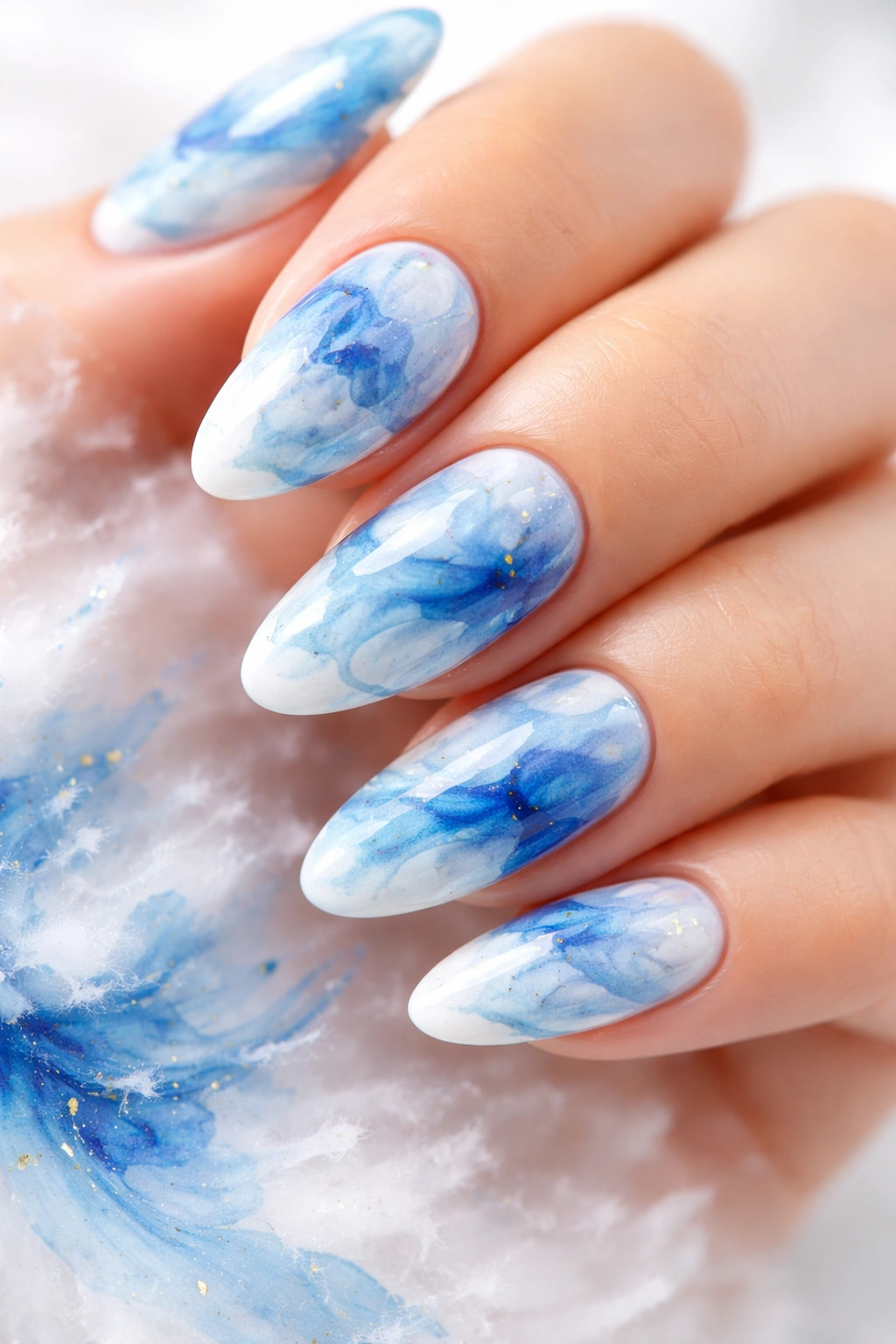 Blue and white abstract watercolor nail art on nails