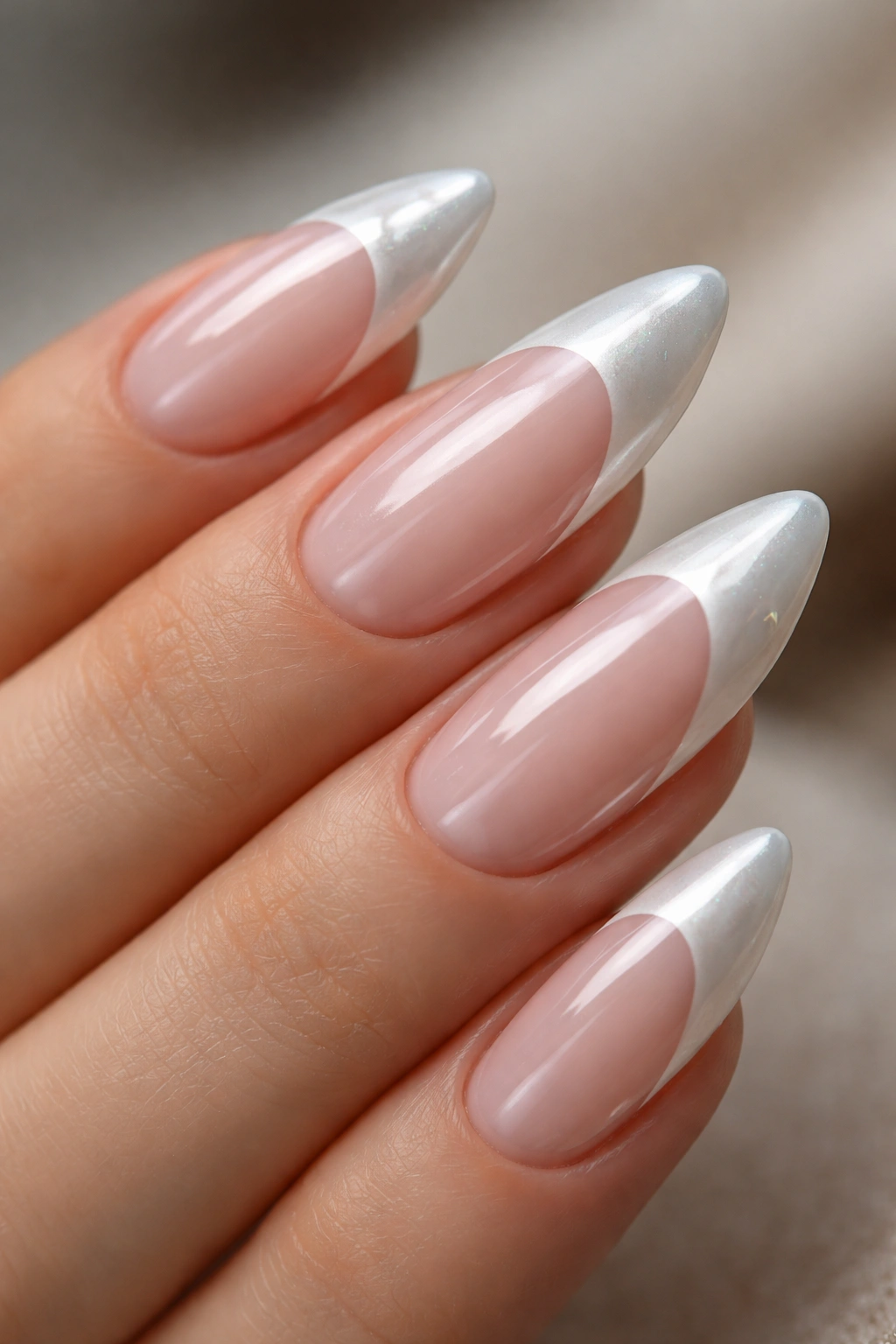 Almond nails with white French tips and chrome glaze overlay