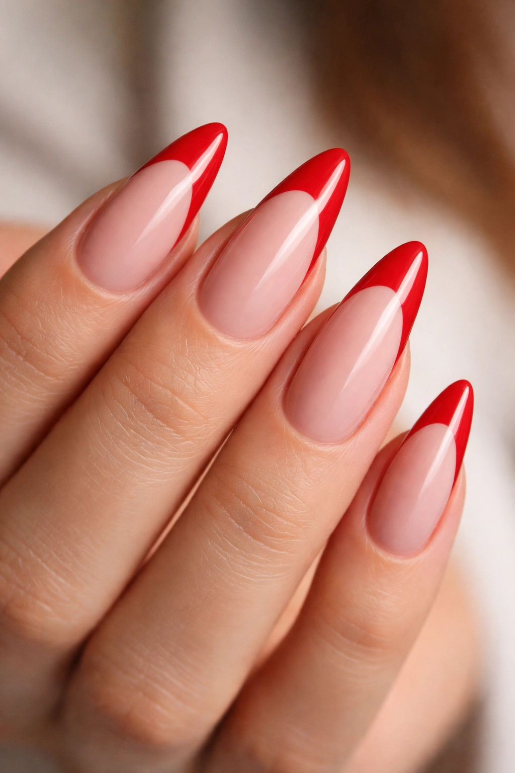 Macro close-up of almond nail shape with curved smile line and long length