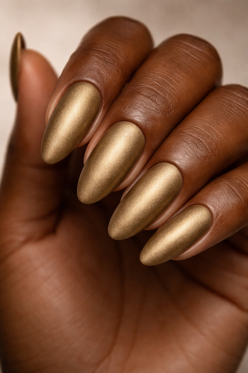 Dark skin nails with antique gold matte finish