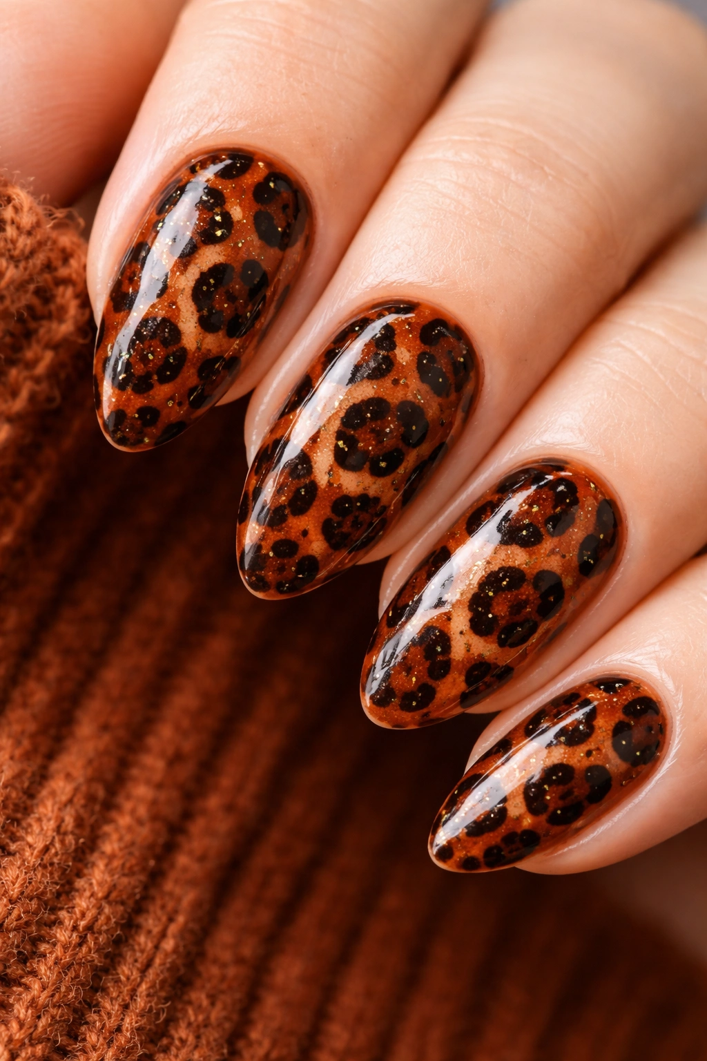 Auburn nails with leopard print pattern