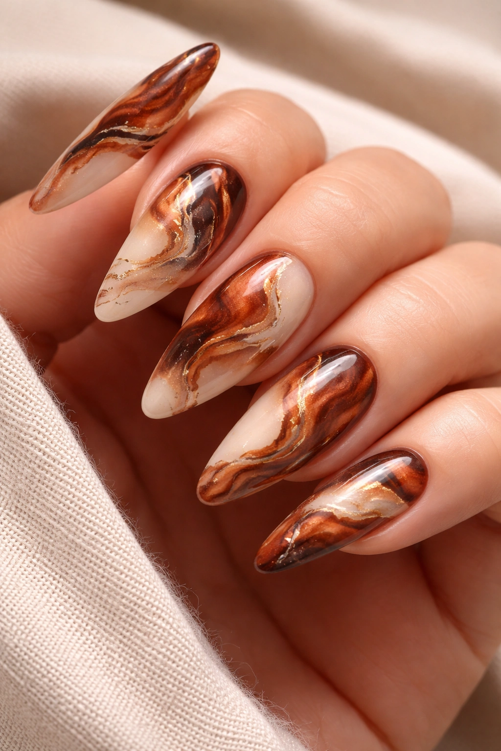 Auburn marble nails with cream and brown swirls