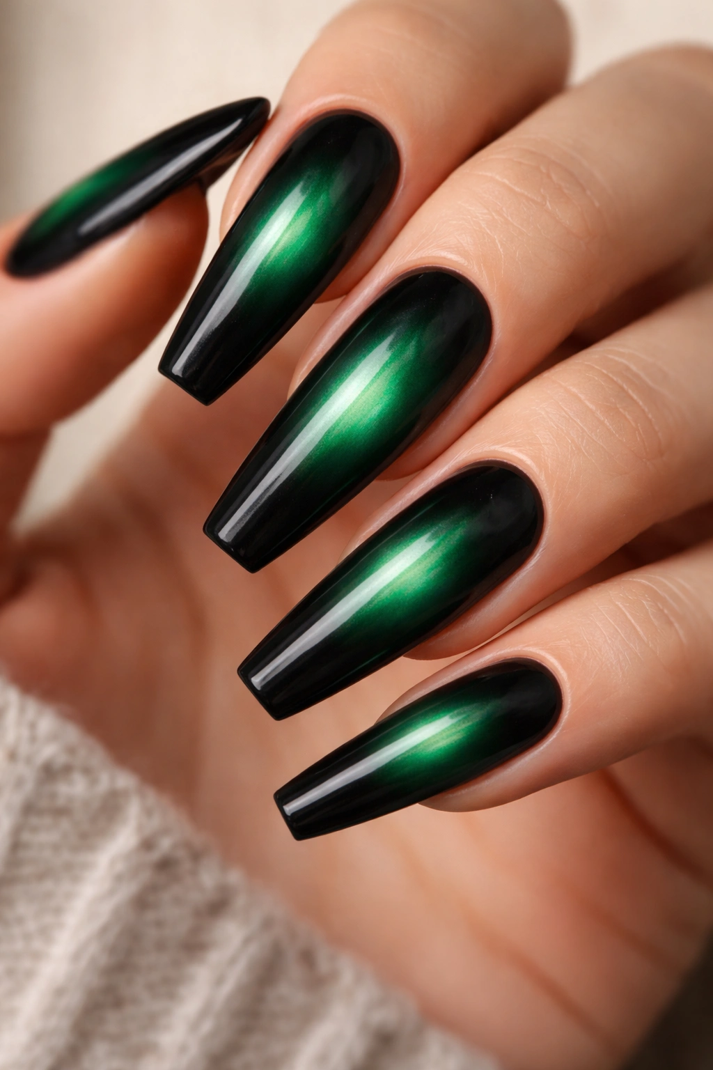 Long green nails with a smoky emerald aura center and dark edges