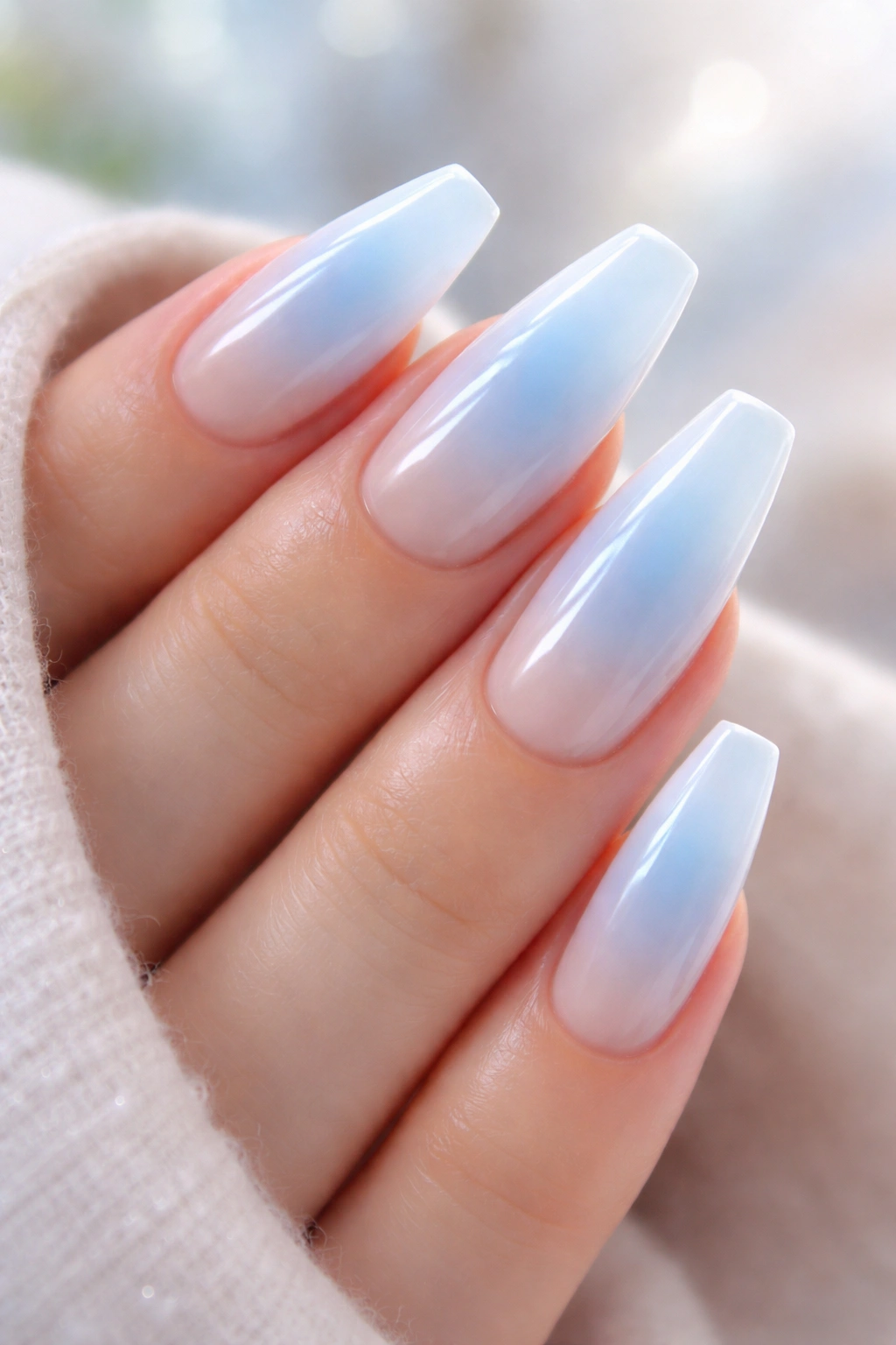 Baby blue aura fade nails with central blue glow