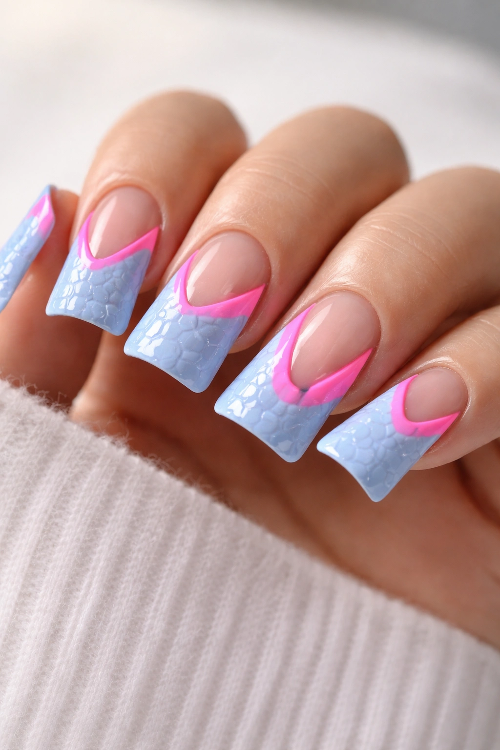 Baby blue nails with croc texture and neon pink negative-space shapes