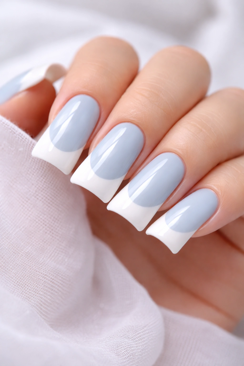 Close-up of baby blue base with white duck tip nails