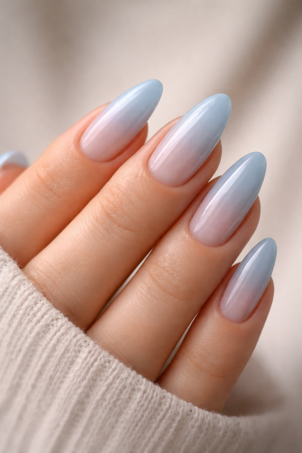 Almond nails in sheer baby blue with translucent look
