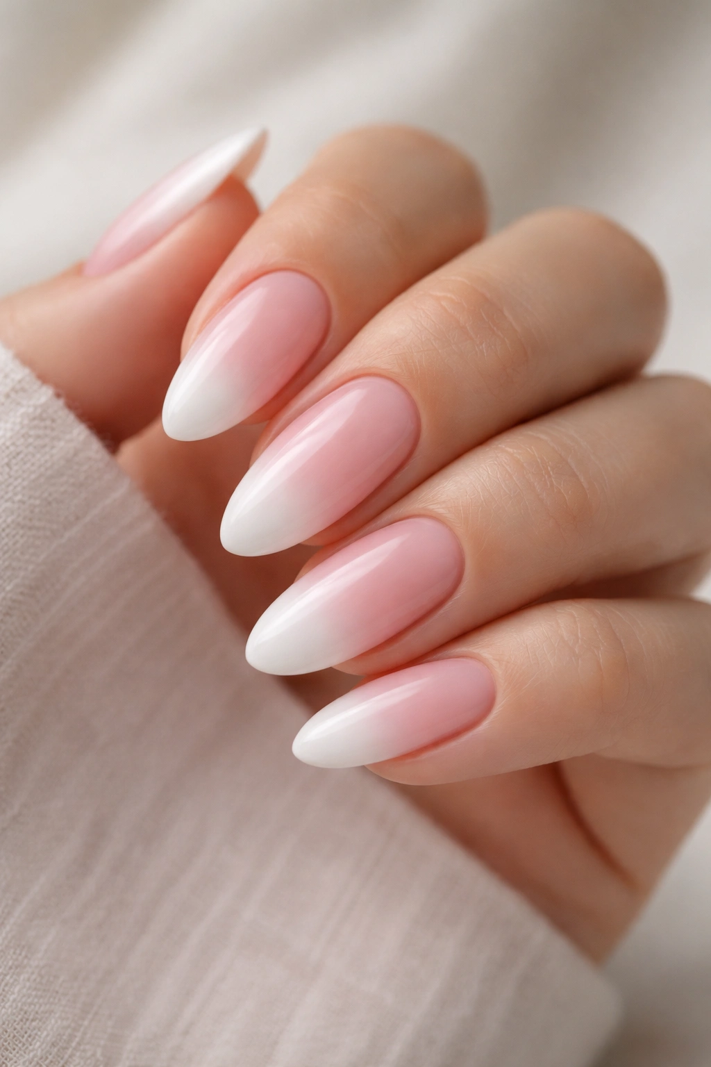 Almond nails with baby pink to white fade