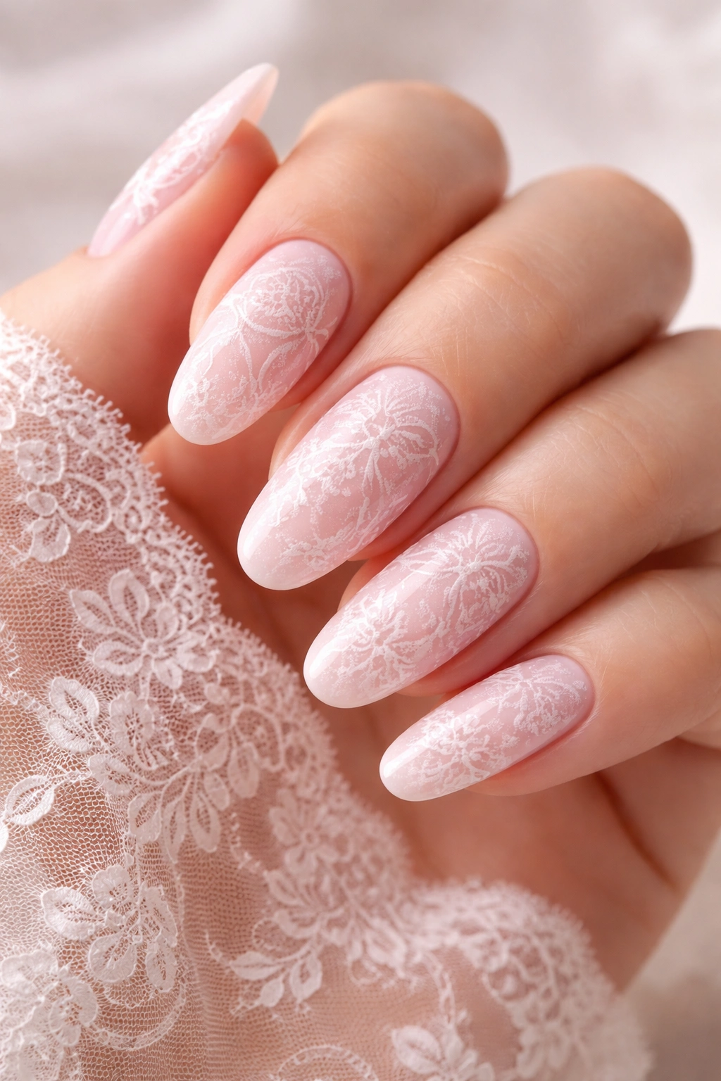 Ballet pink nails with lace overlay close-up