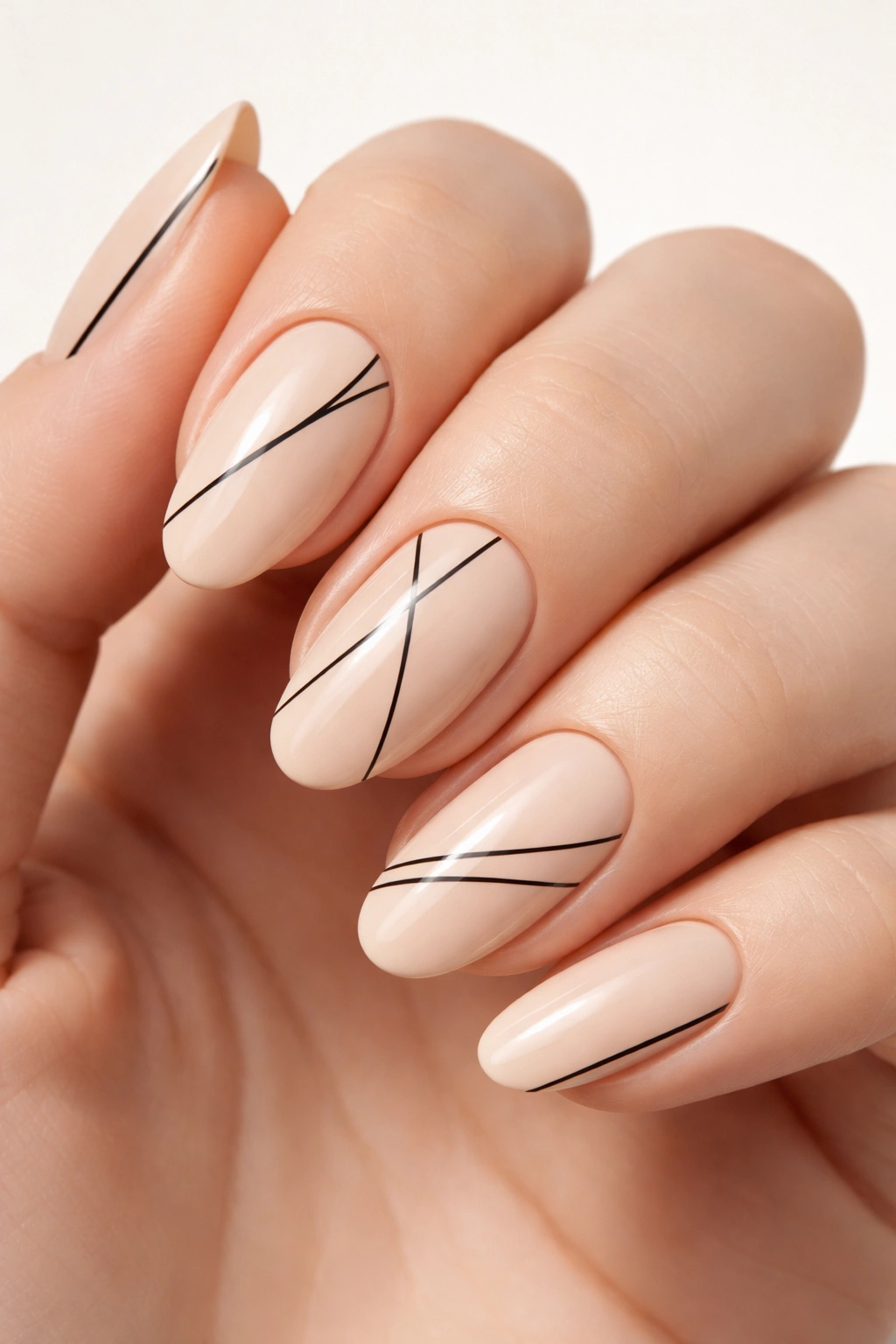 Beige nails with black line geometric details