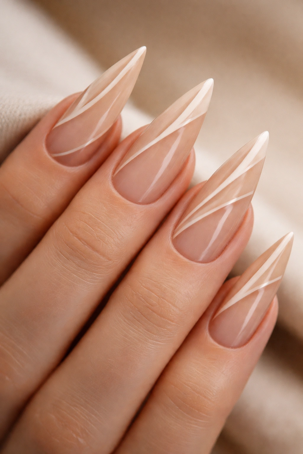 Beige stiletto nails with negative space geometric design