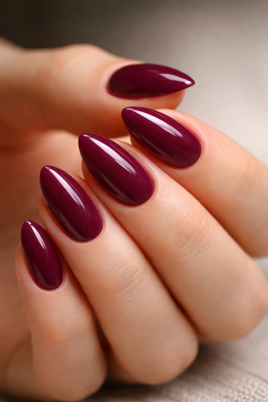 Deep berry color on tiny almond nails with short length