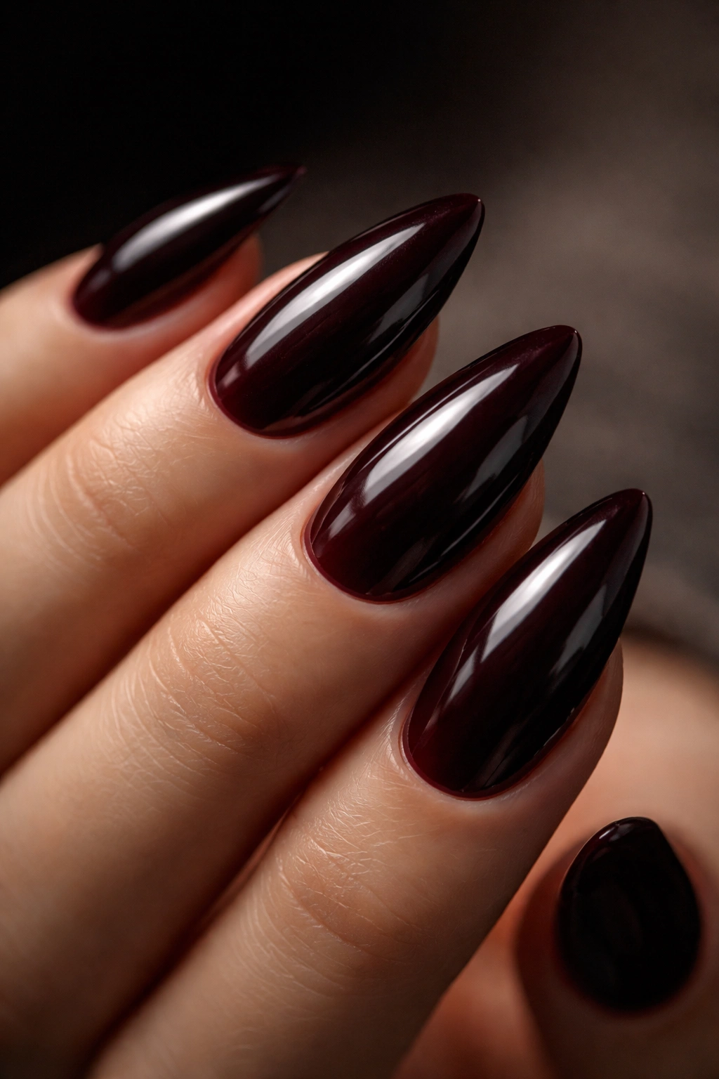 Almond nails in black cherry deep reddish-purple glossy finish