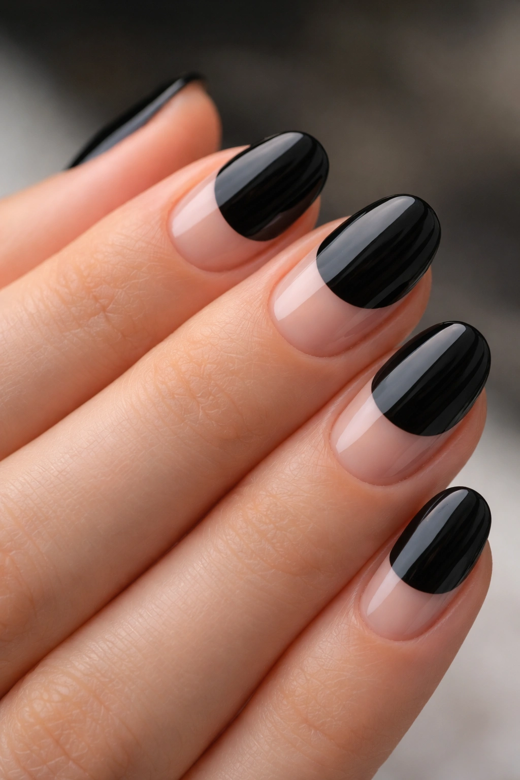 Short oval nails with black and clear negative-space design
