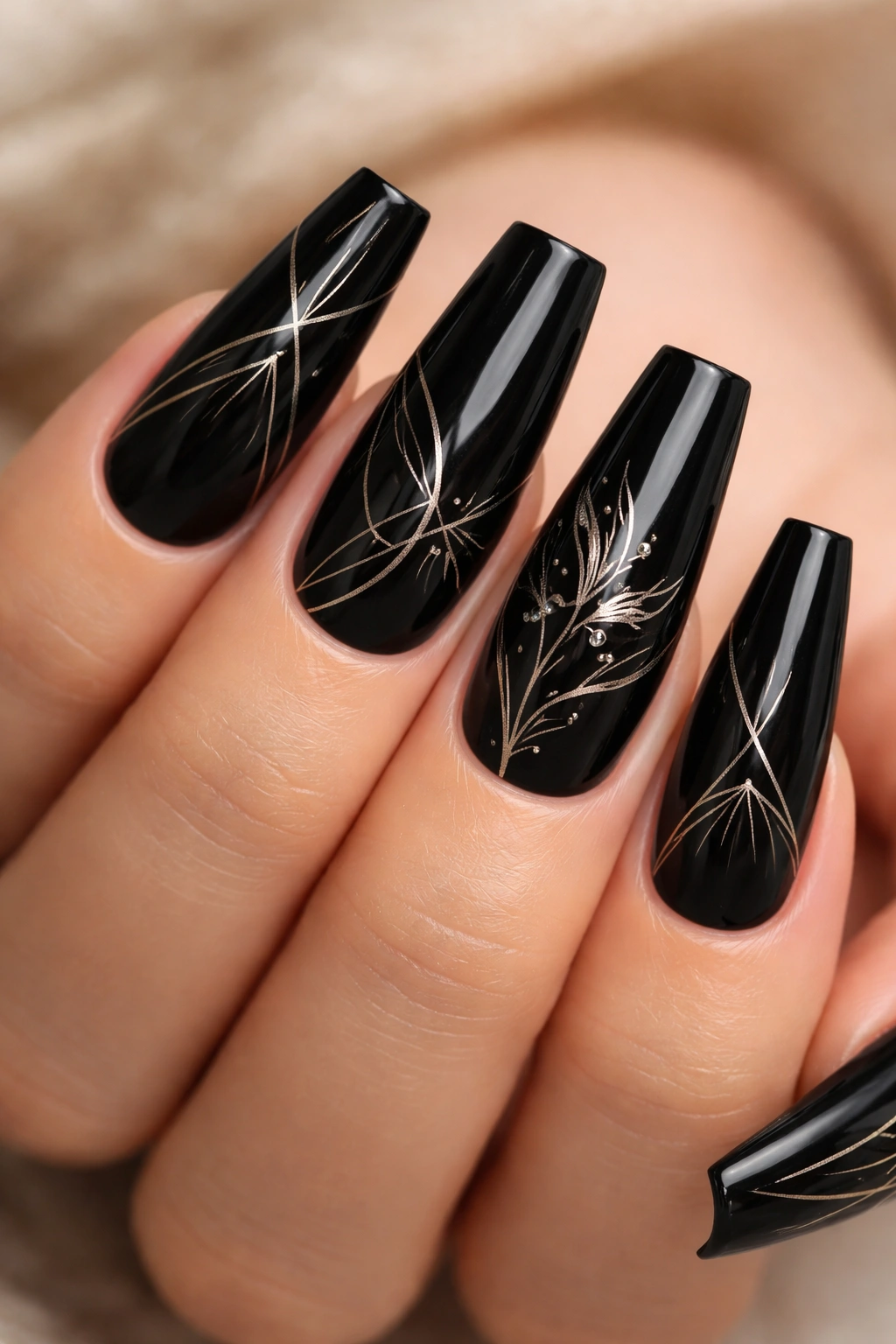 Black coffin nails with fine metallic line art patterns