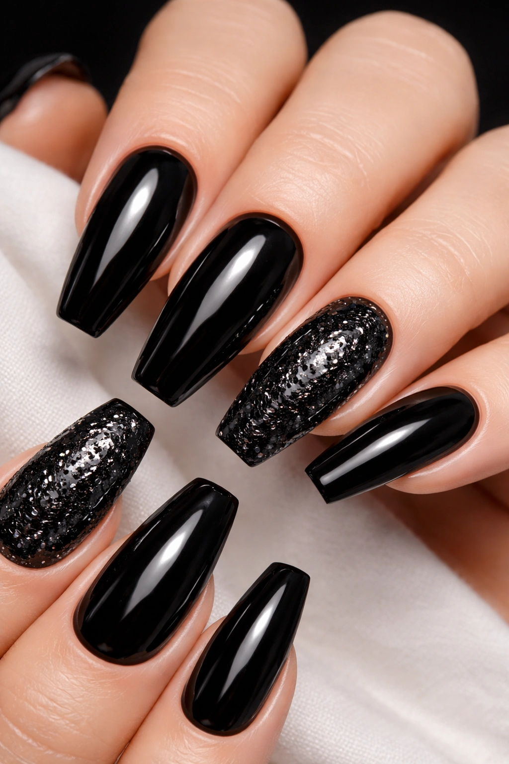 Nails with black glitter accent on a few nails