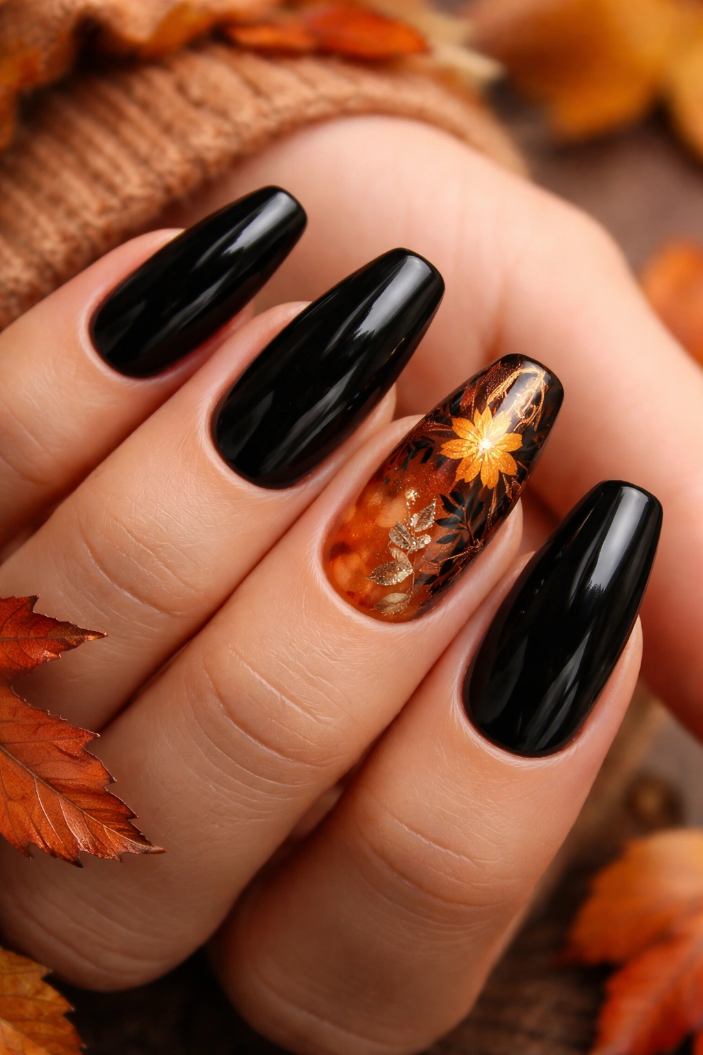 Close-up of black nails with autumnal burnt orange and copper accents