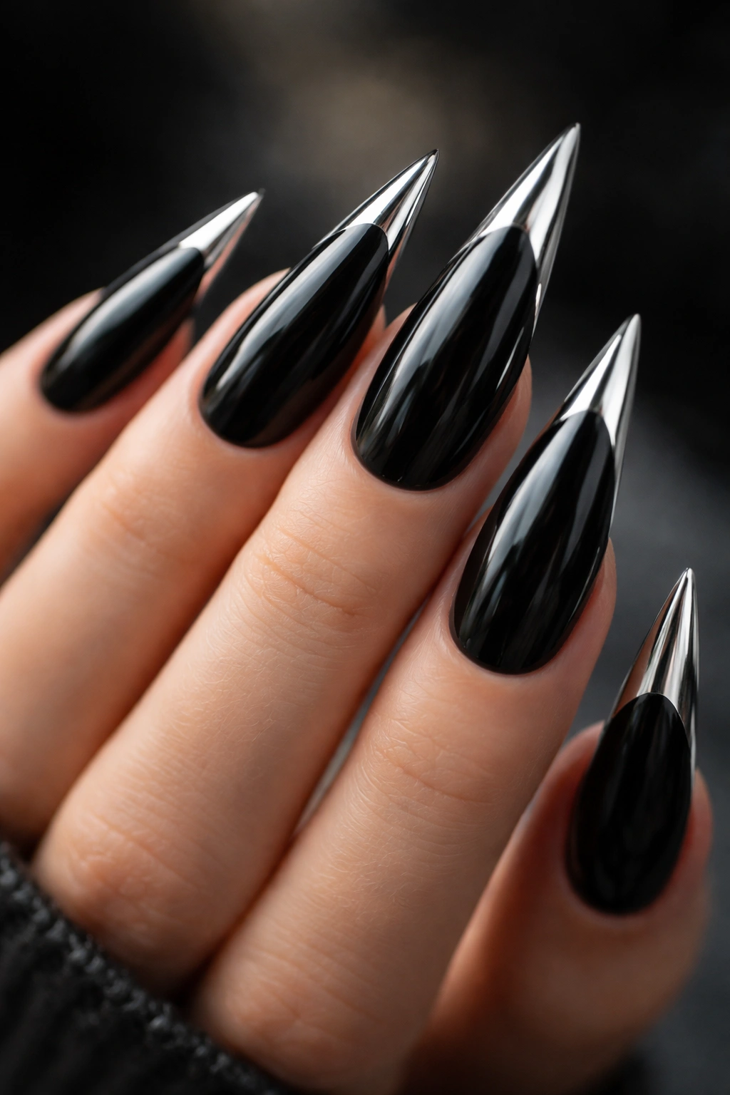 Black stiletto nails with chrome tips