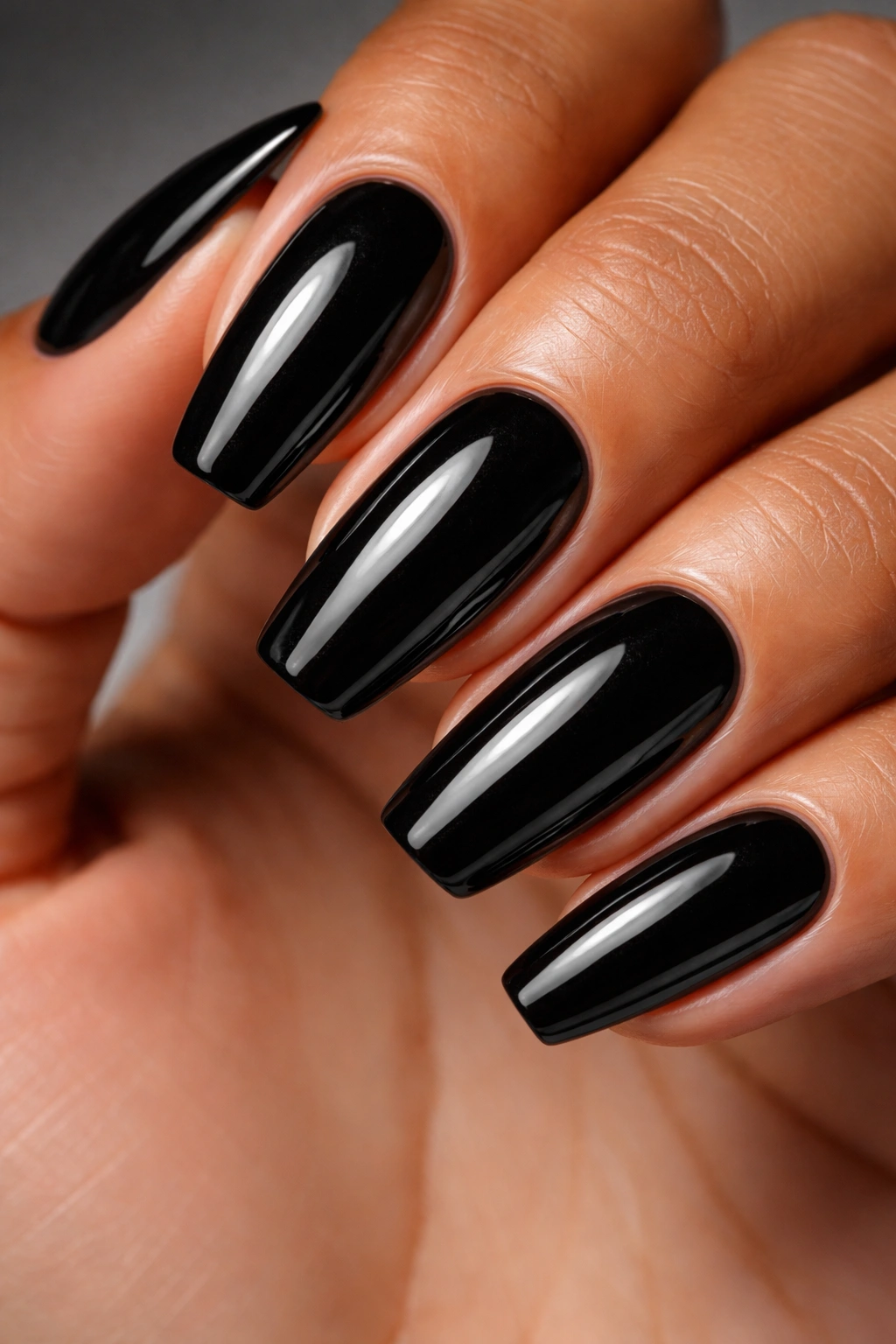 Close-up of glossy black nails