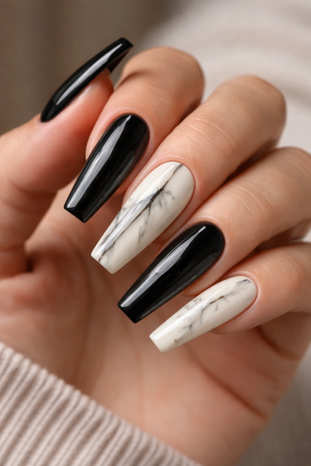 Black onyx and ivory split marble nail on a ballerina hand
