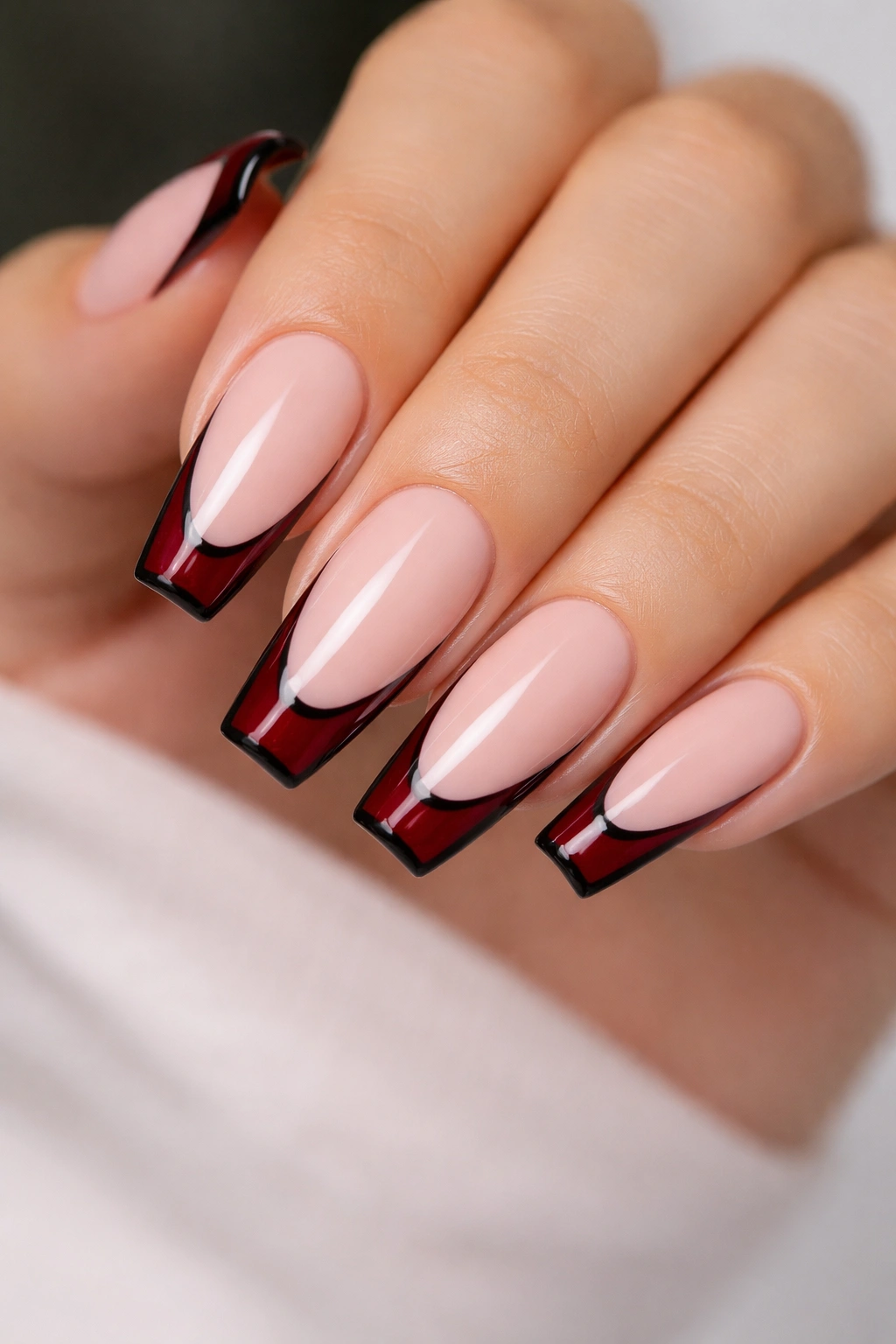 Coffin nails with nude base burgundy tips and black outline