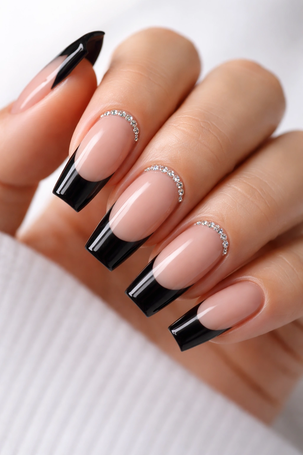 Black French tip ballerina nails with tiny crystals at cuticles