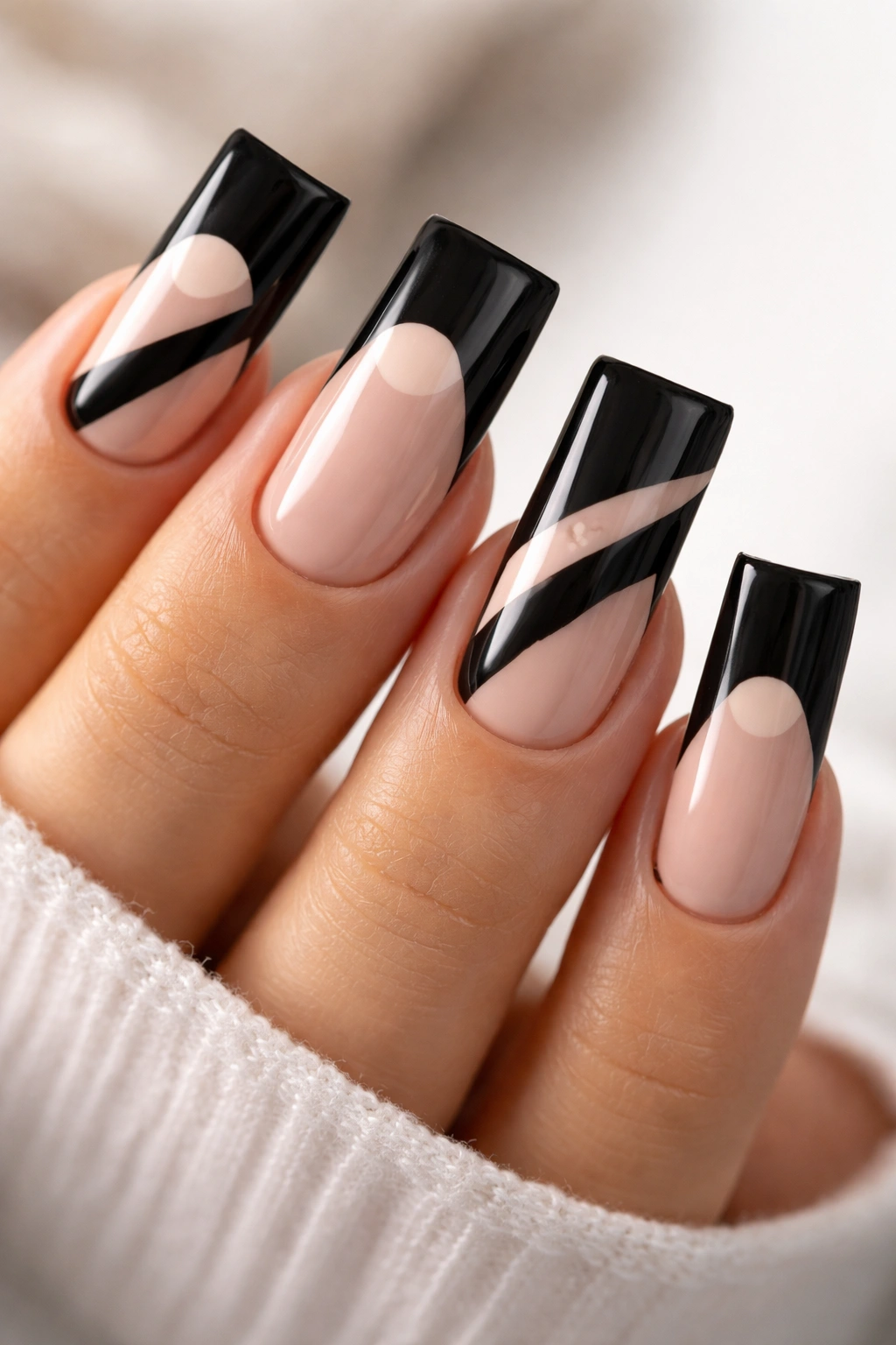 Duck nails with black tips and nude negative space shapes
