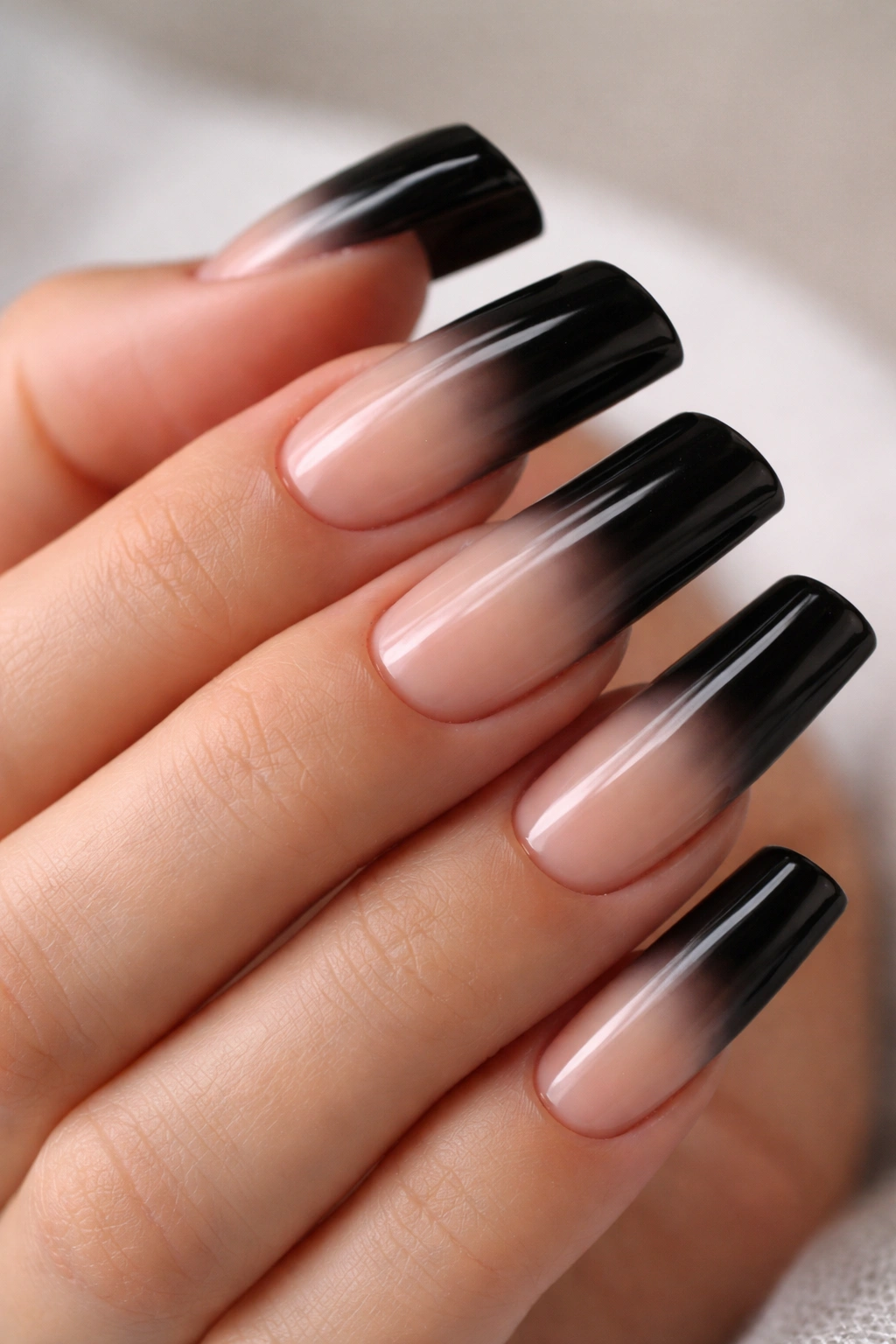 Duck nails with black tips fading into nude base ombre