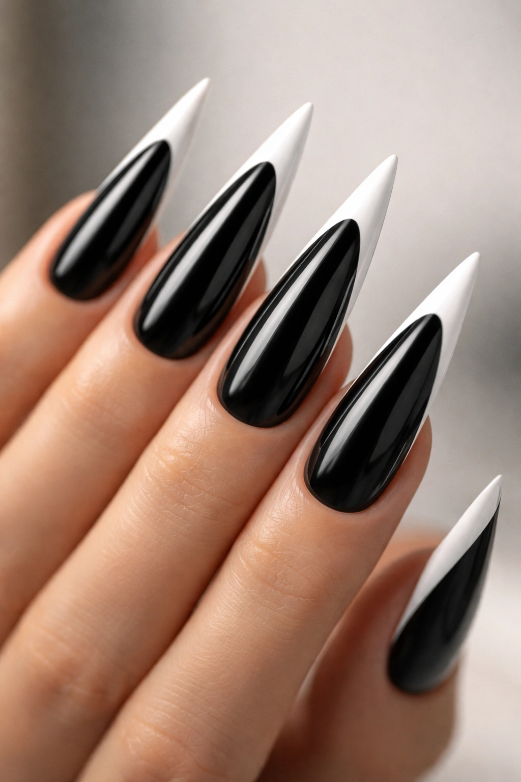 Close-up of black nails with white-edged French tips