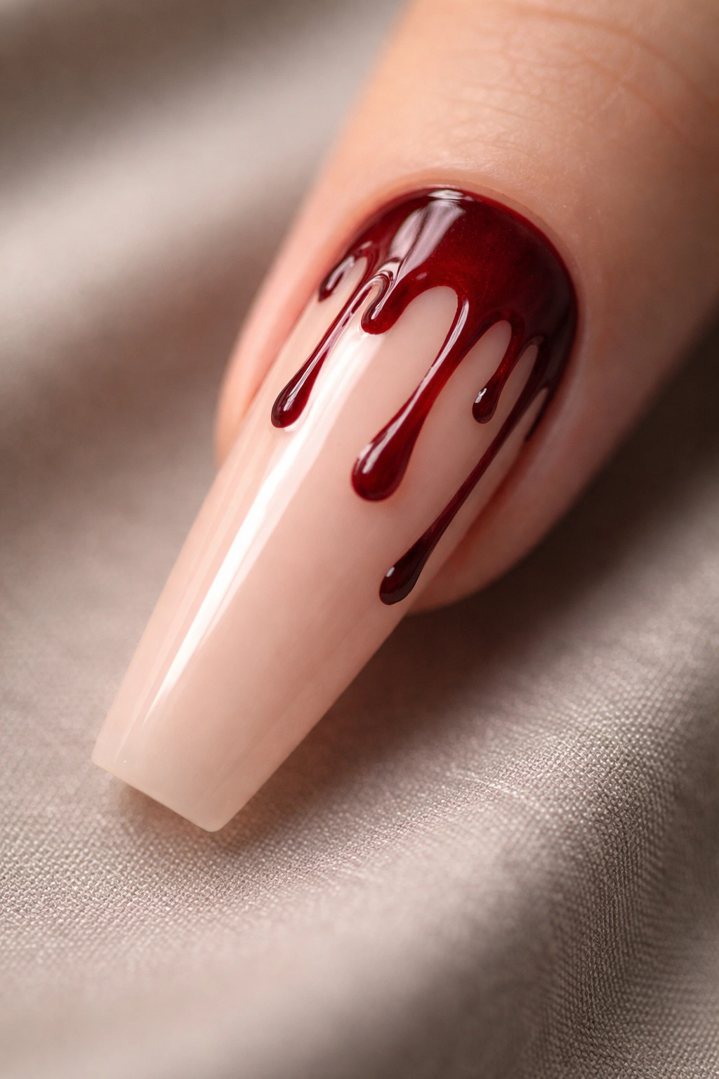 Coffin nail with nude base and red blood drip