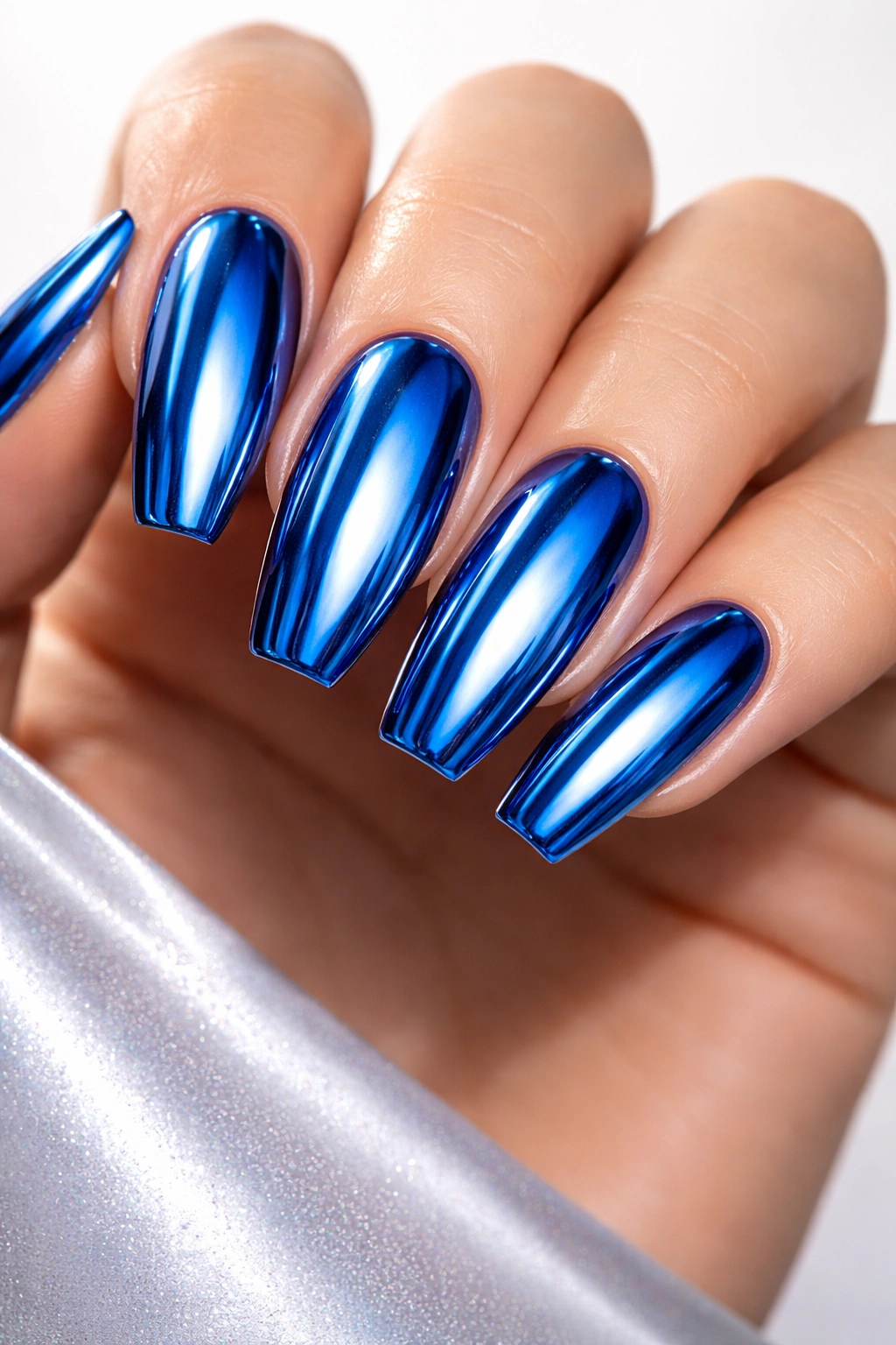 Blue chrome nails with mirror-like finish