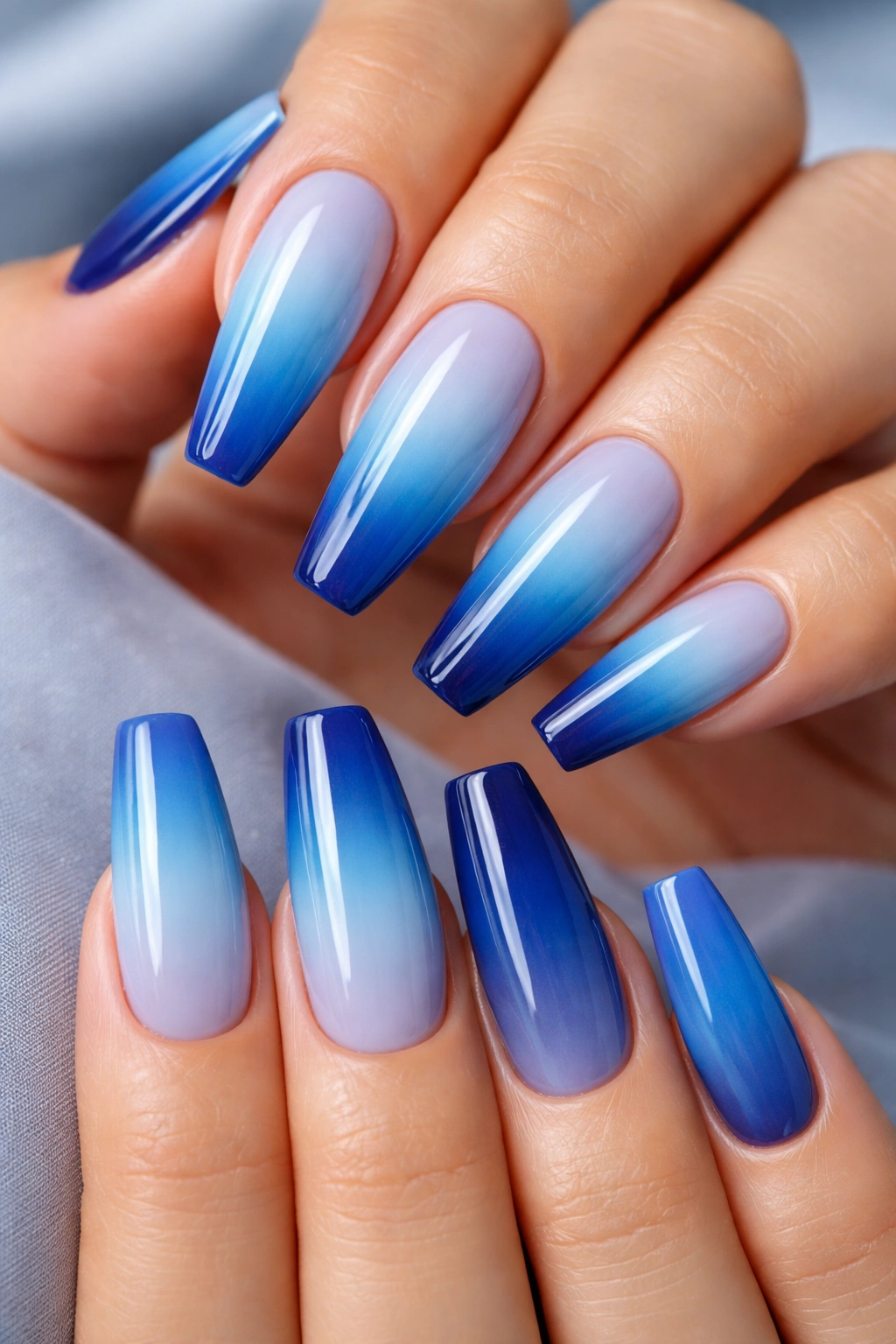 Nail set with an ocean gradient from sky blue to deep sea across all ten ballerina nails