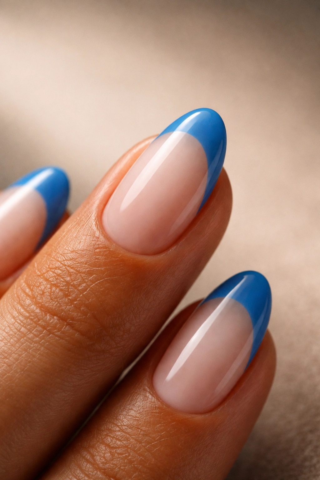 Single short almond nail with blue shade on neutral skin tone