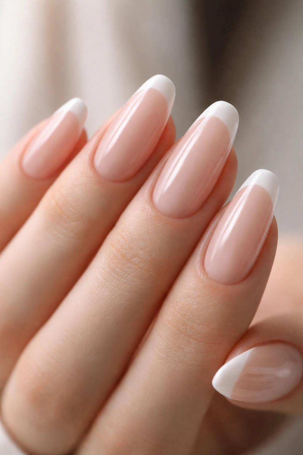 Nails with blurred white micro French tips on a sheer base